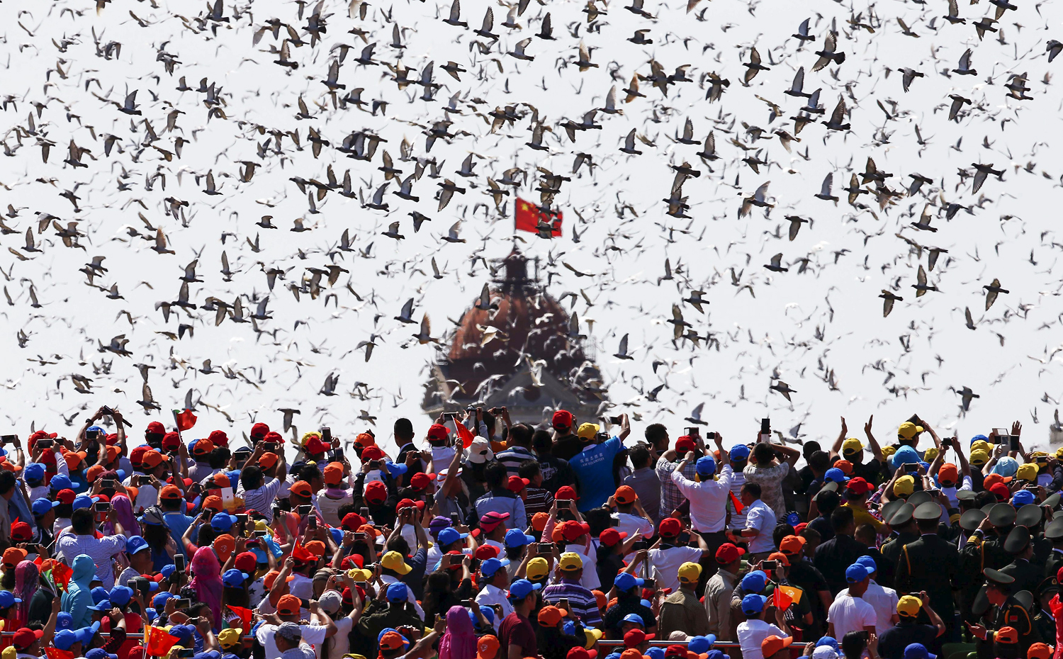 Thousands of balloons are released during the military parade marking the 70th anniversary of the end of the second world war. Photo: Reuters