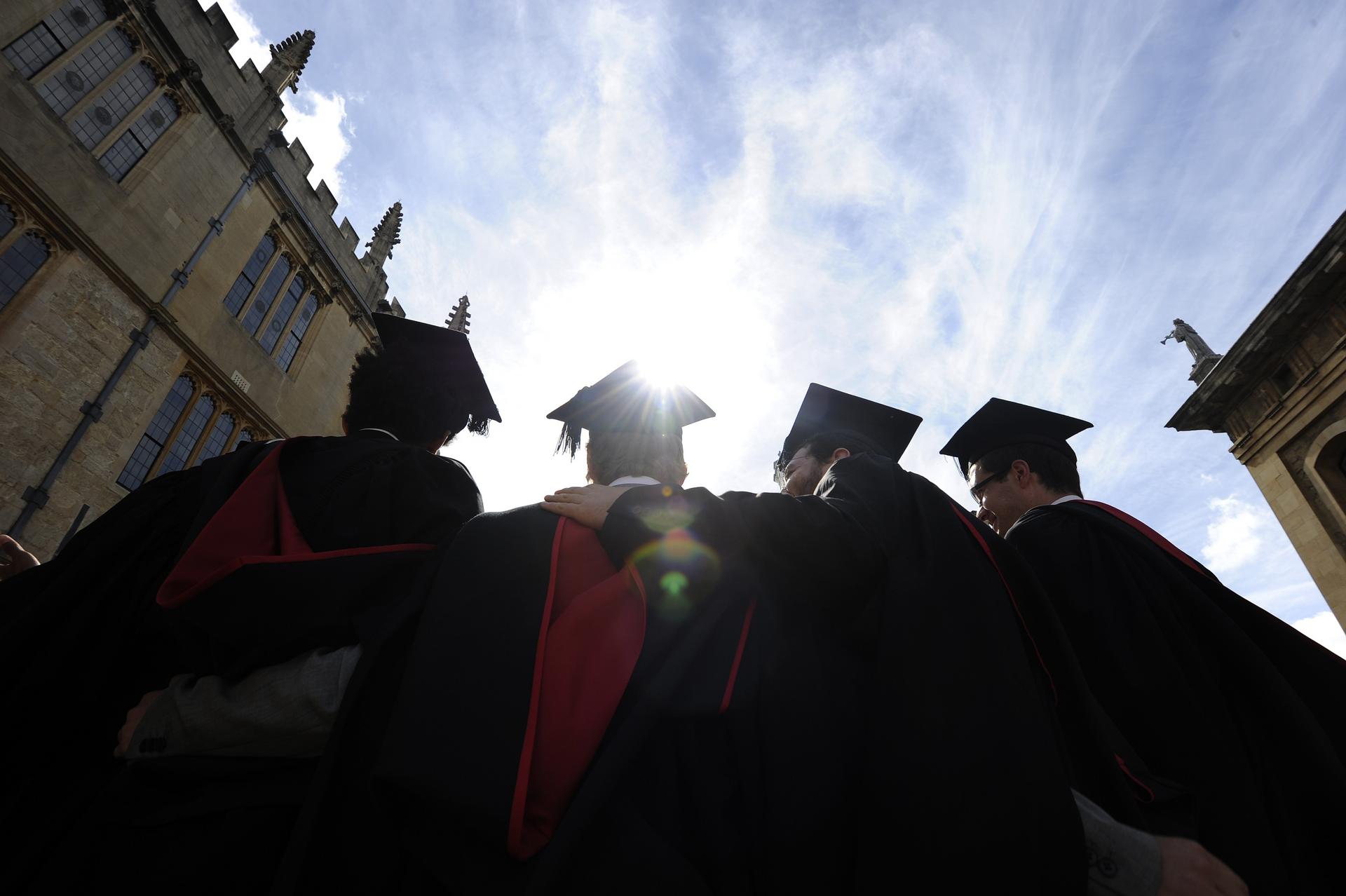 Graduates at Oxford University, England. Oxford is among a handful of top universities in Britain that are not increasing student enrolments. Photo: Reuters
