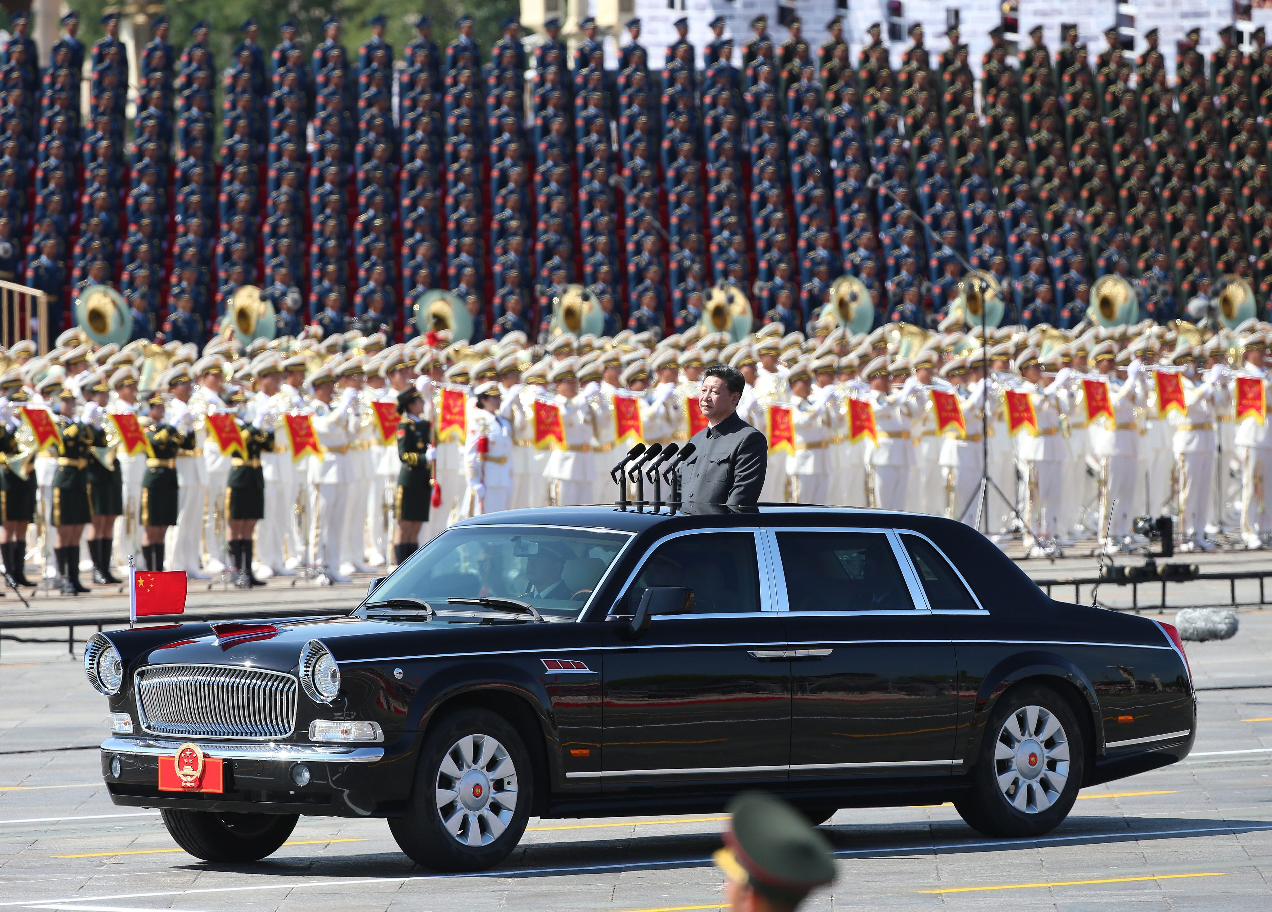 Chinese President Xi Jinping inspects troops in his purpose-made limousine. Photo: EPA