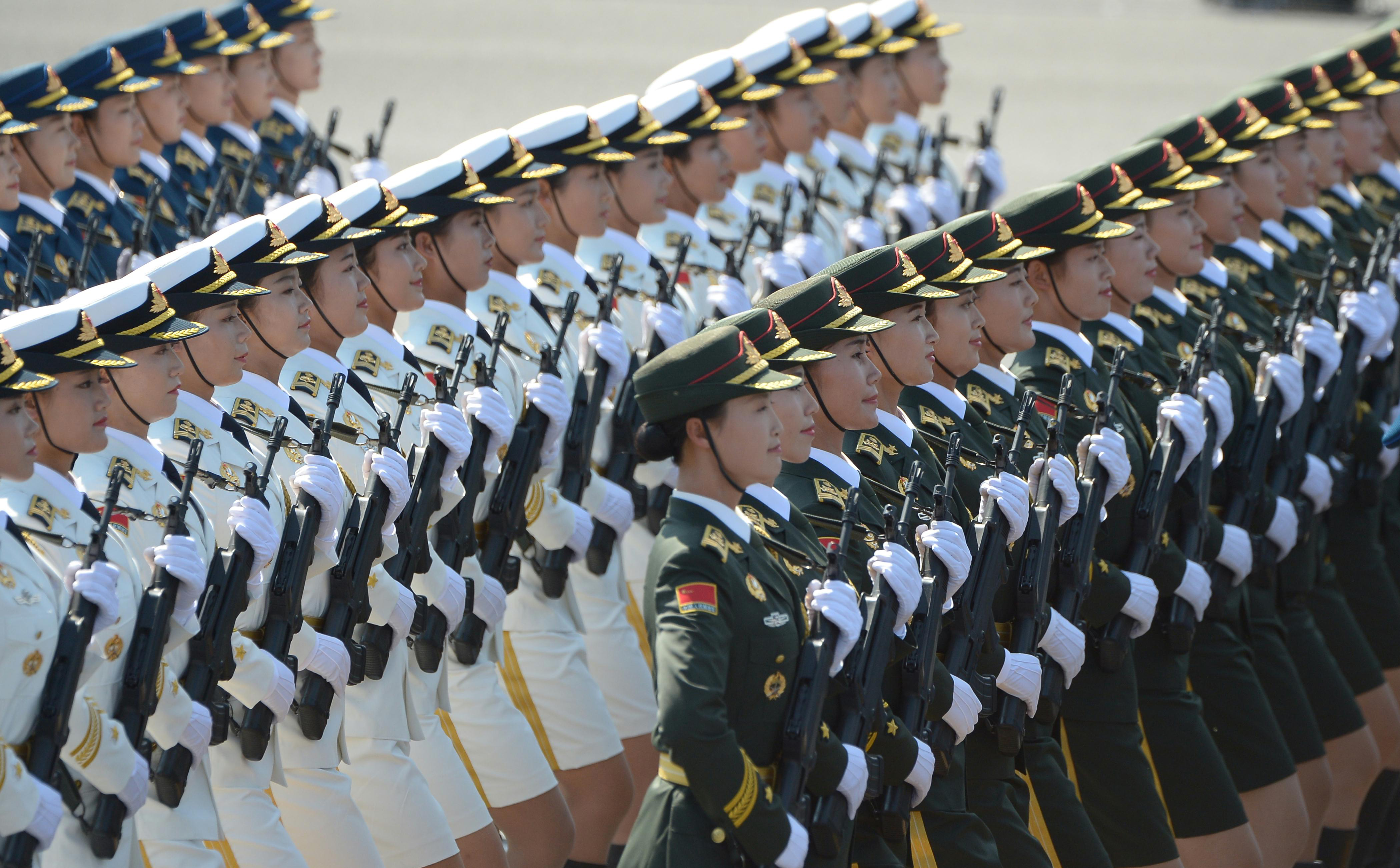 The guard of honor of the three services of the Chinese People's Liberation Army attends a military parade in Beijing. Photo: Xinhua