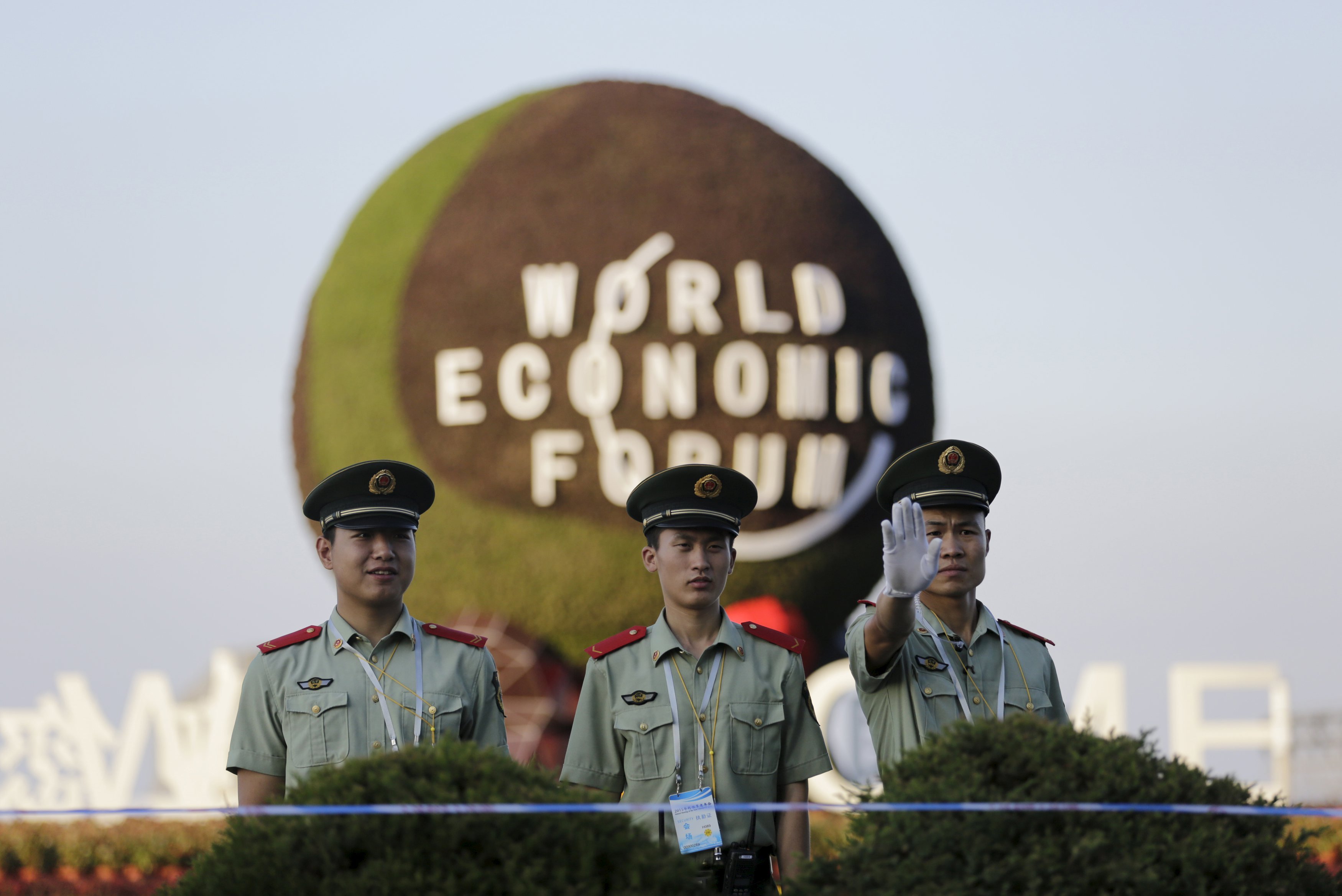 Paramilitary police officers stand guard outside the venue of the ongoing WEF meeting in Dalian. Photo: Reuters