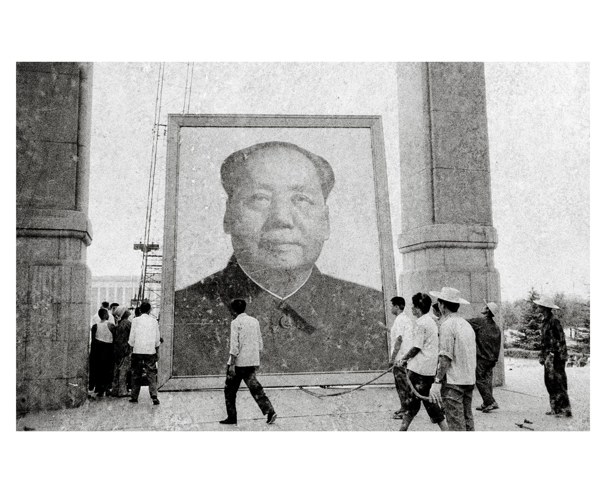 A portrait of Mao being taken down. Photos: Bob Davis