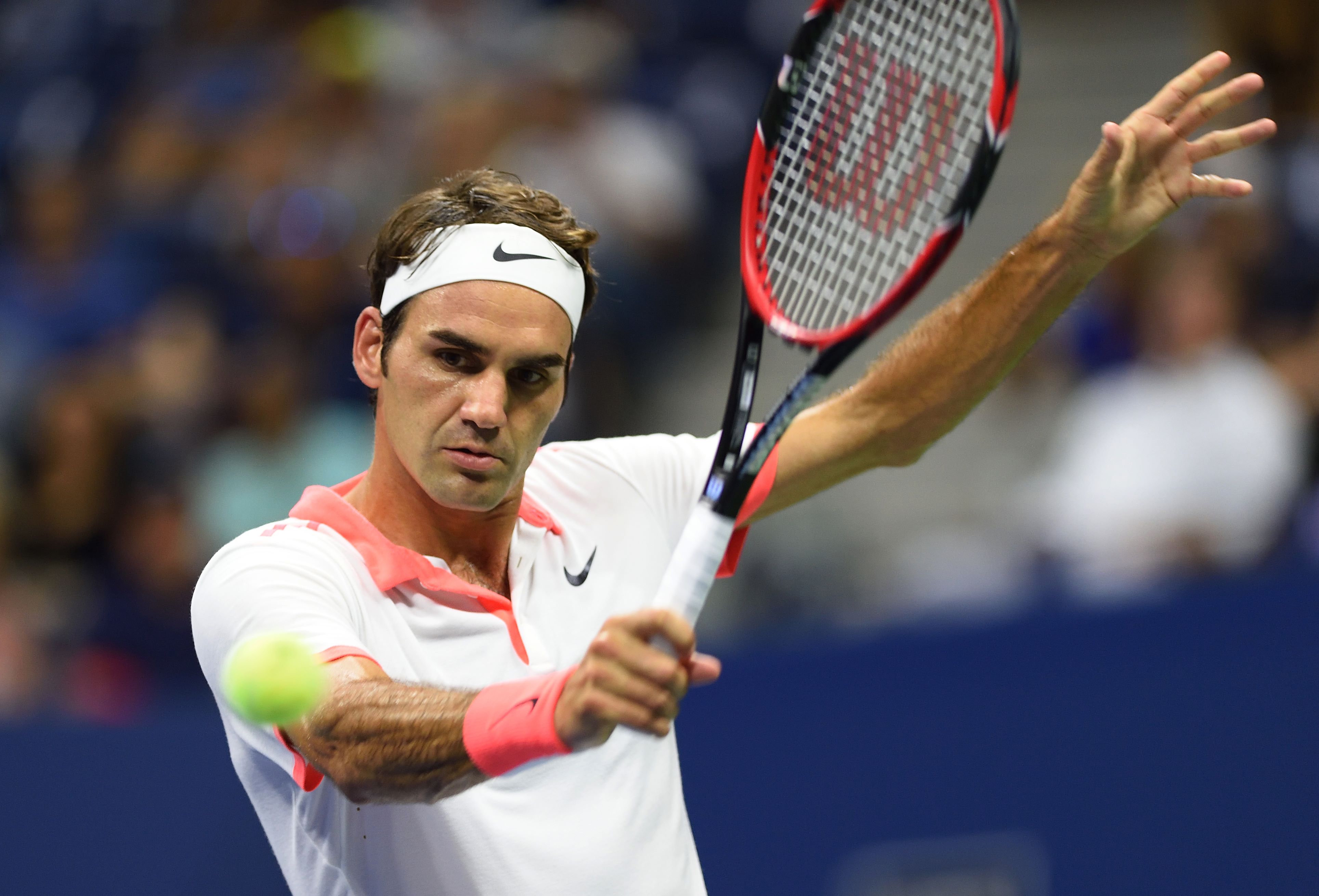 Roger Federer hits a backhand. Photo: AFP