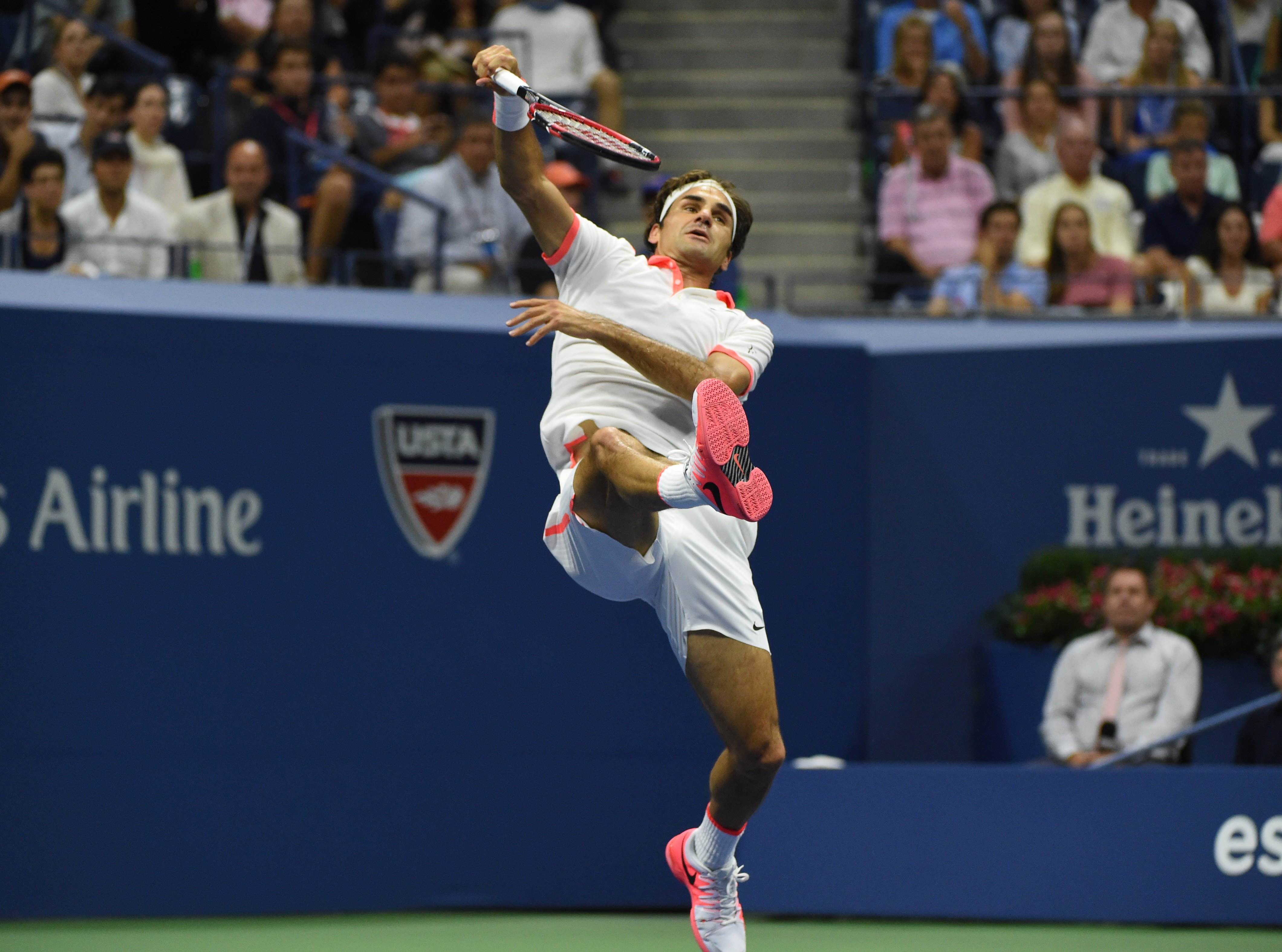 Roger Federer returns to Stan Wawrinka. Photo: AFP