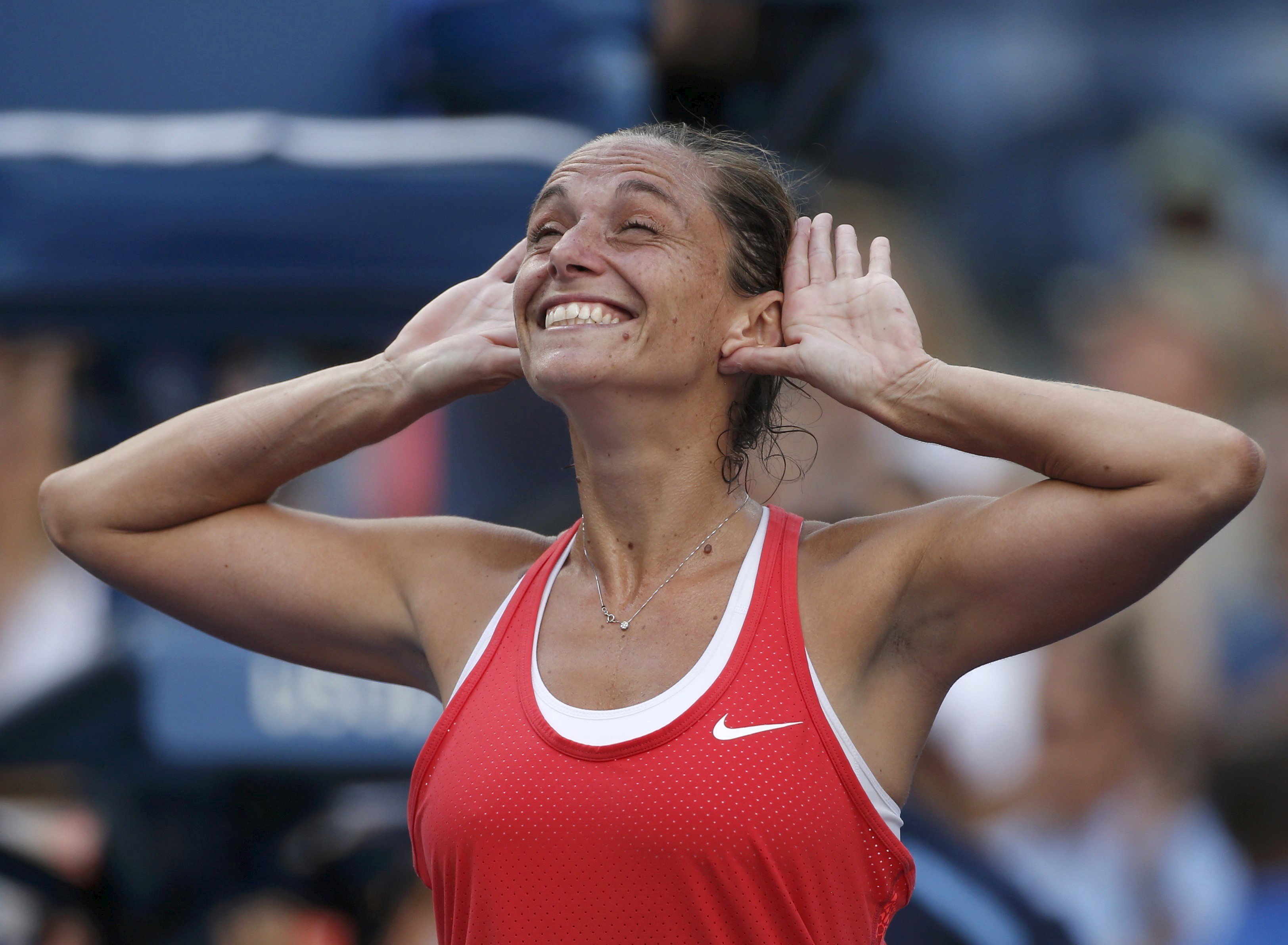 Roberta Vinci celebrates with the crowd after defeating Serena Williams. Photo: Reuters
