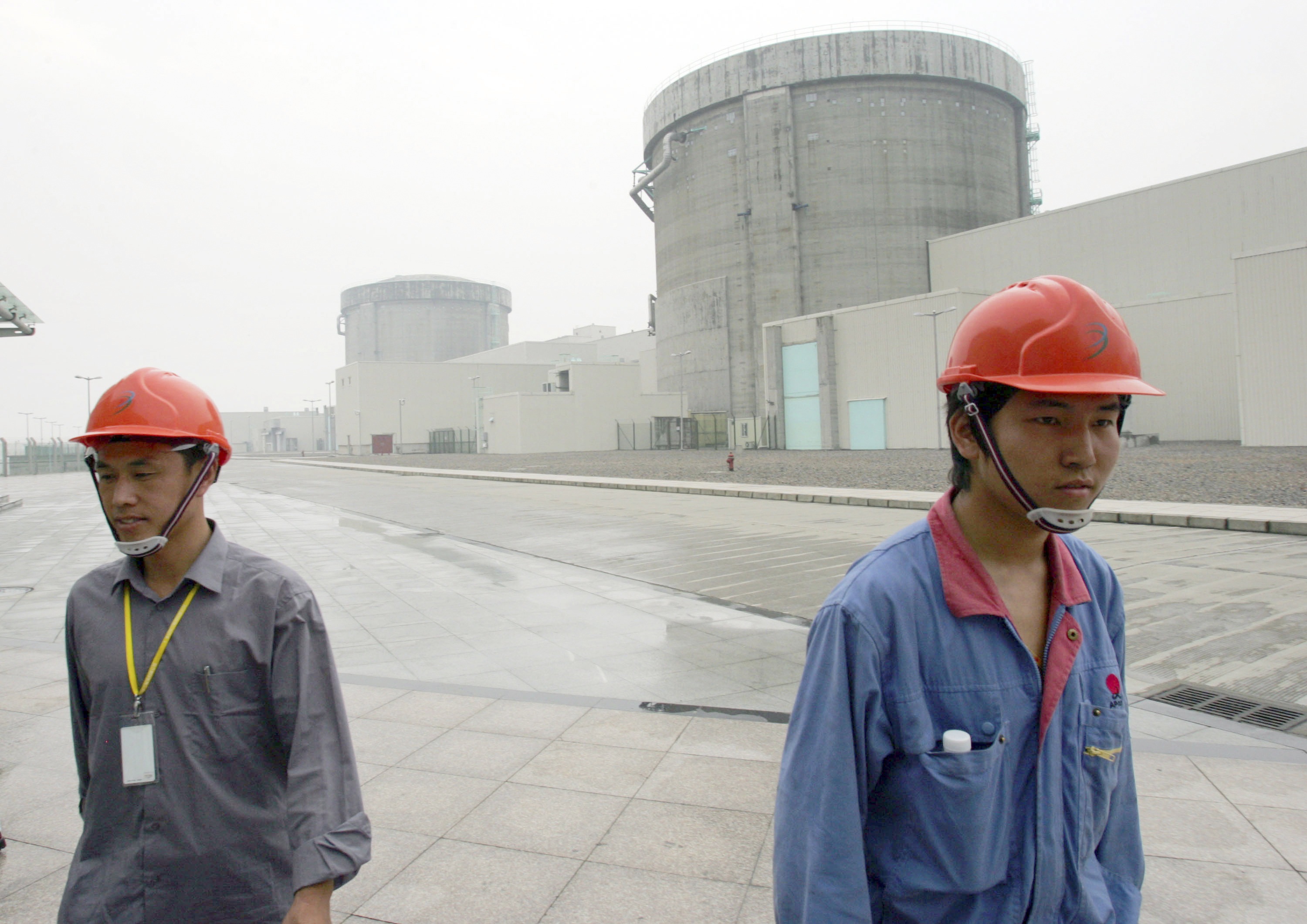 Chinese workers leave the nuclear power plant in Qinshan, in Zhejiang province, which will be inspected as part of nationwide safety checks. Photo Reuters