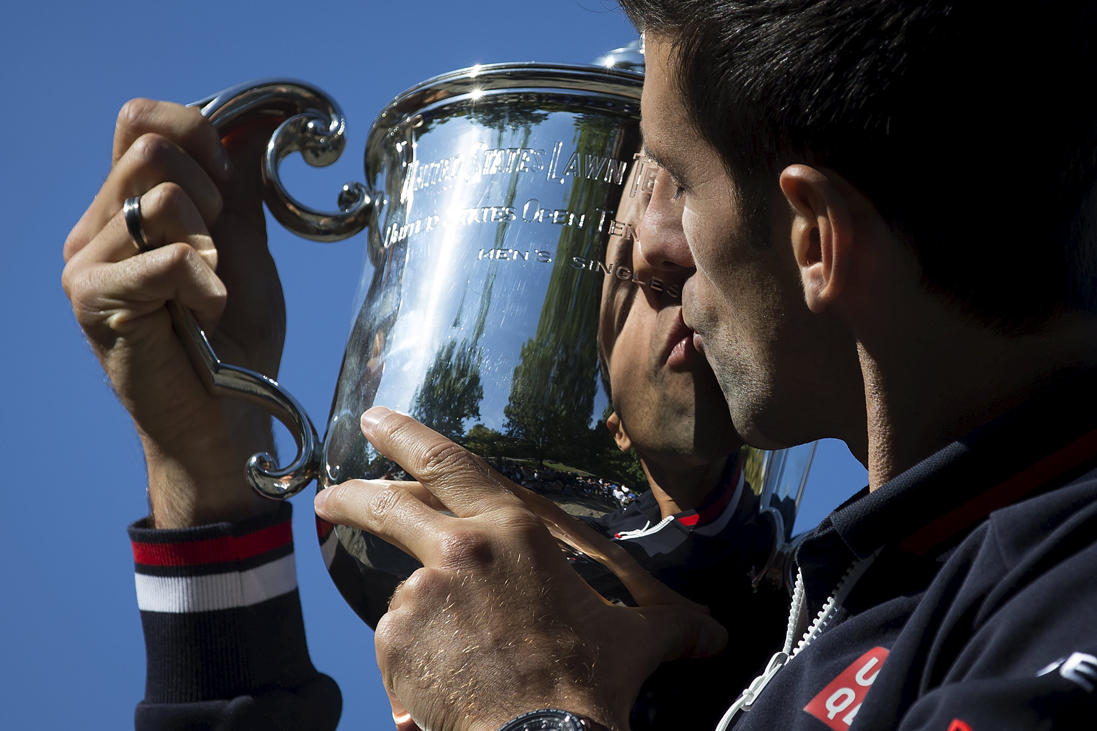 Novak Djokovic kisses the trophy. Photo: Reuters