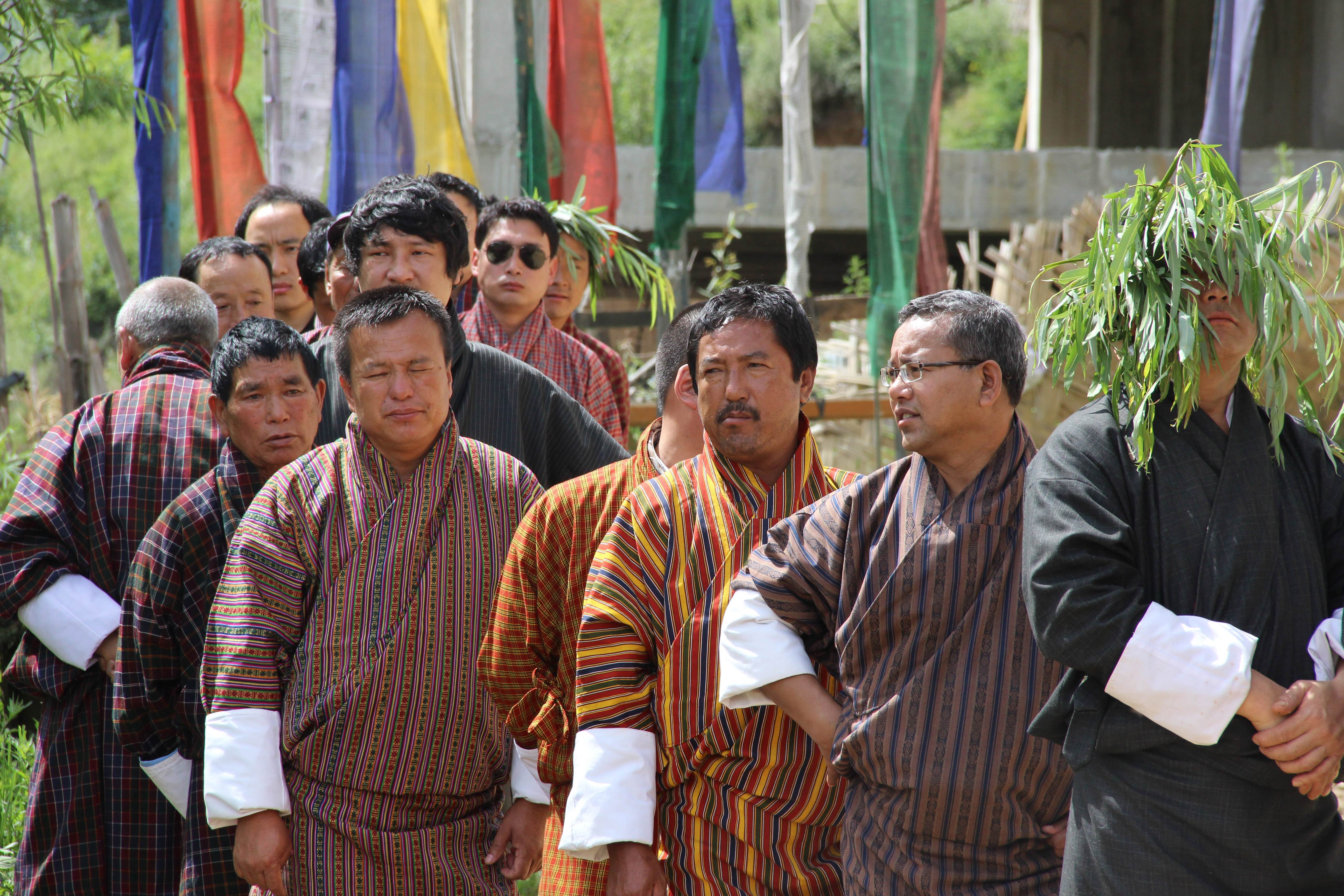 Men line up in Thimphu in Bhutan, which measures Gross National Happiness along with GDP. Photo: AFP