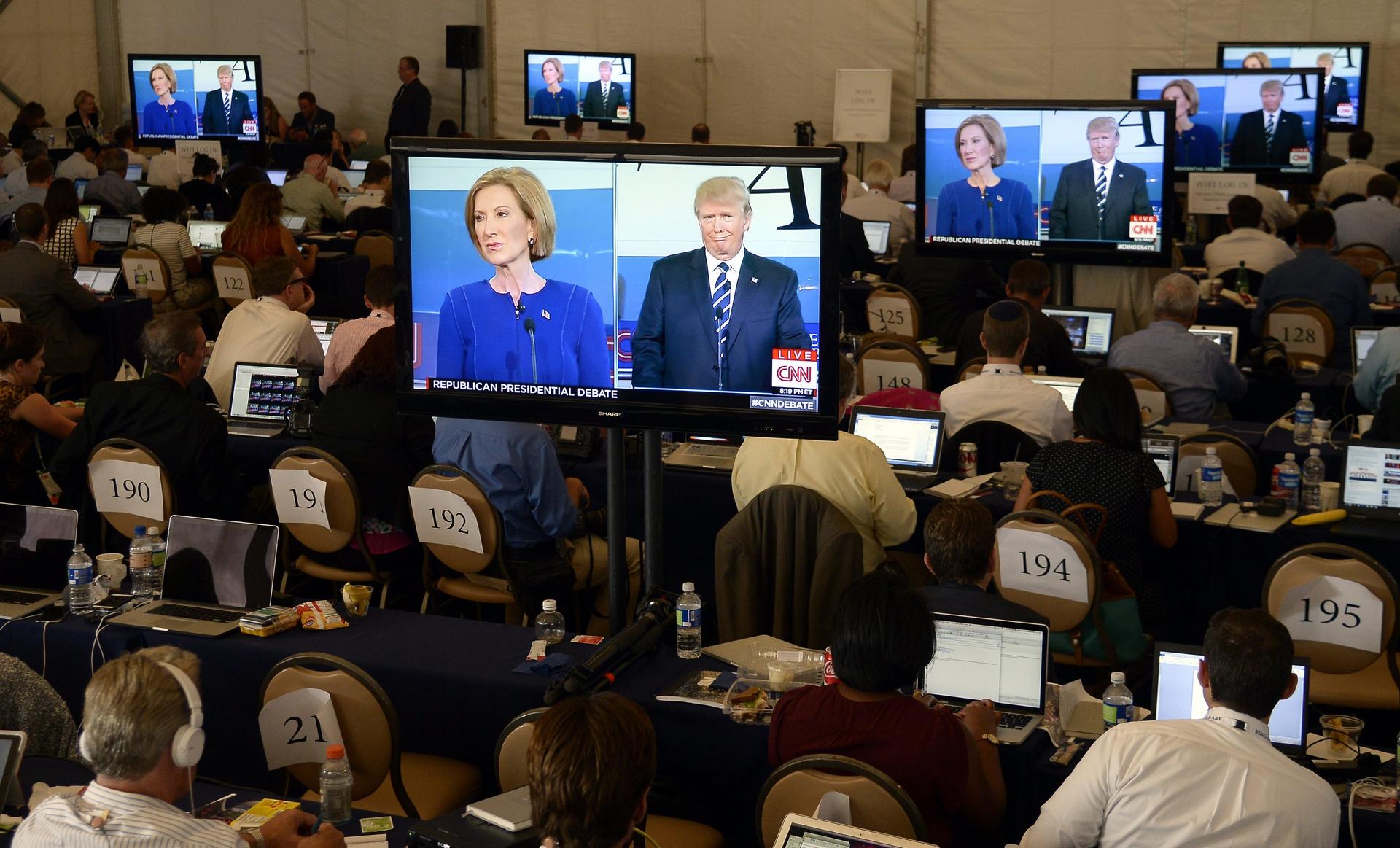 Media watch an exchange between US Republican presidential candidates Donald Trump and Carly Fiorina during the debate. Photo: EPA