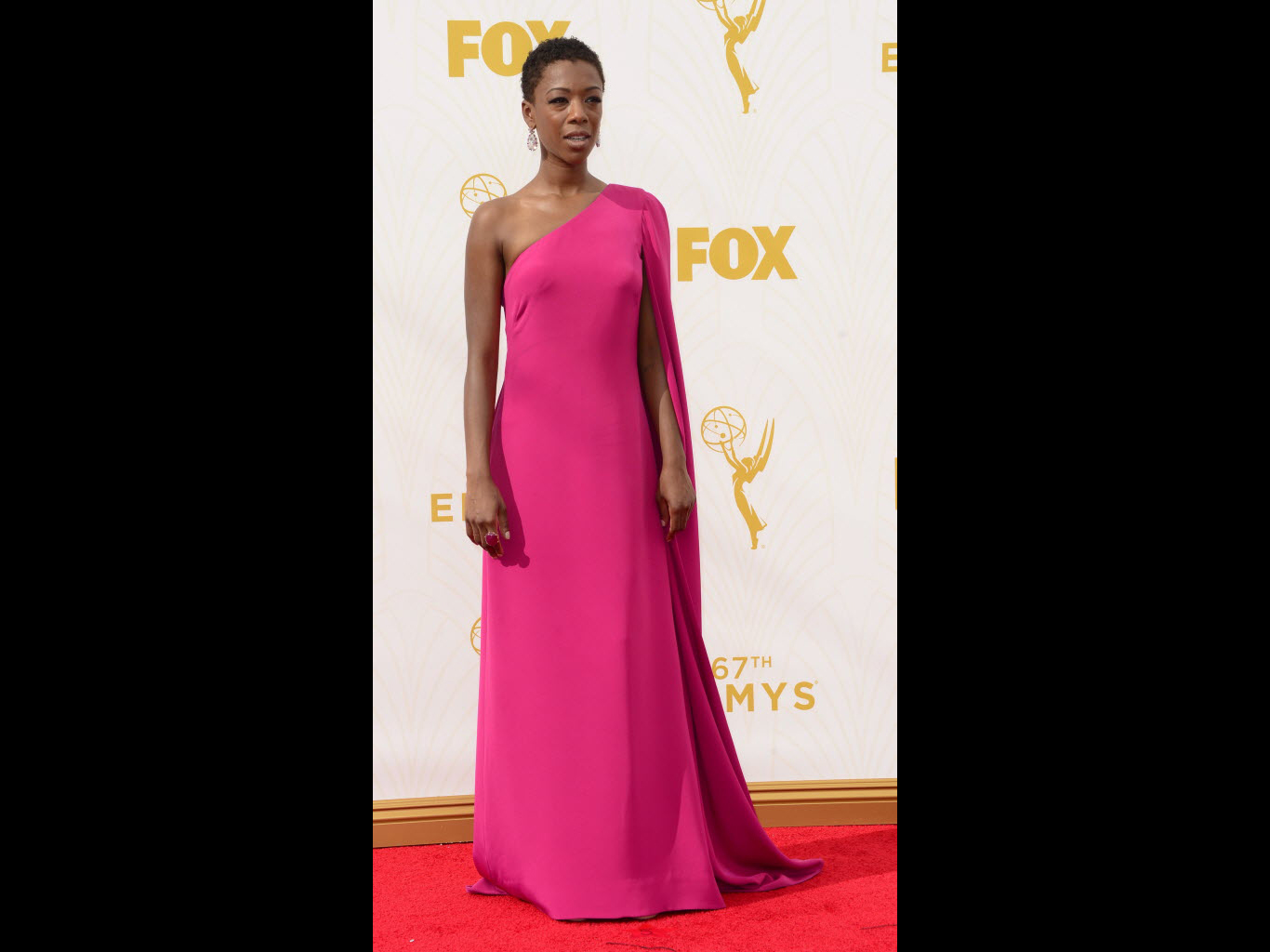 Best dressed: Samira Wiley looked sublime in a shocking pink cape dress. Photo: EPA