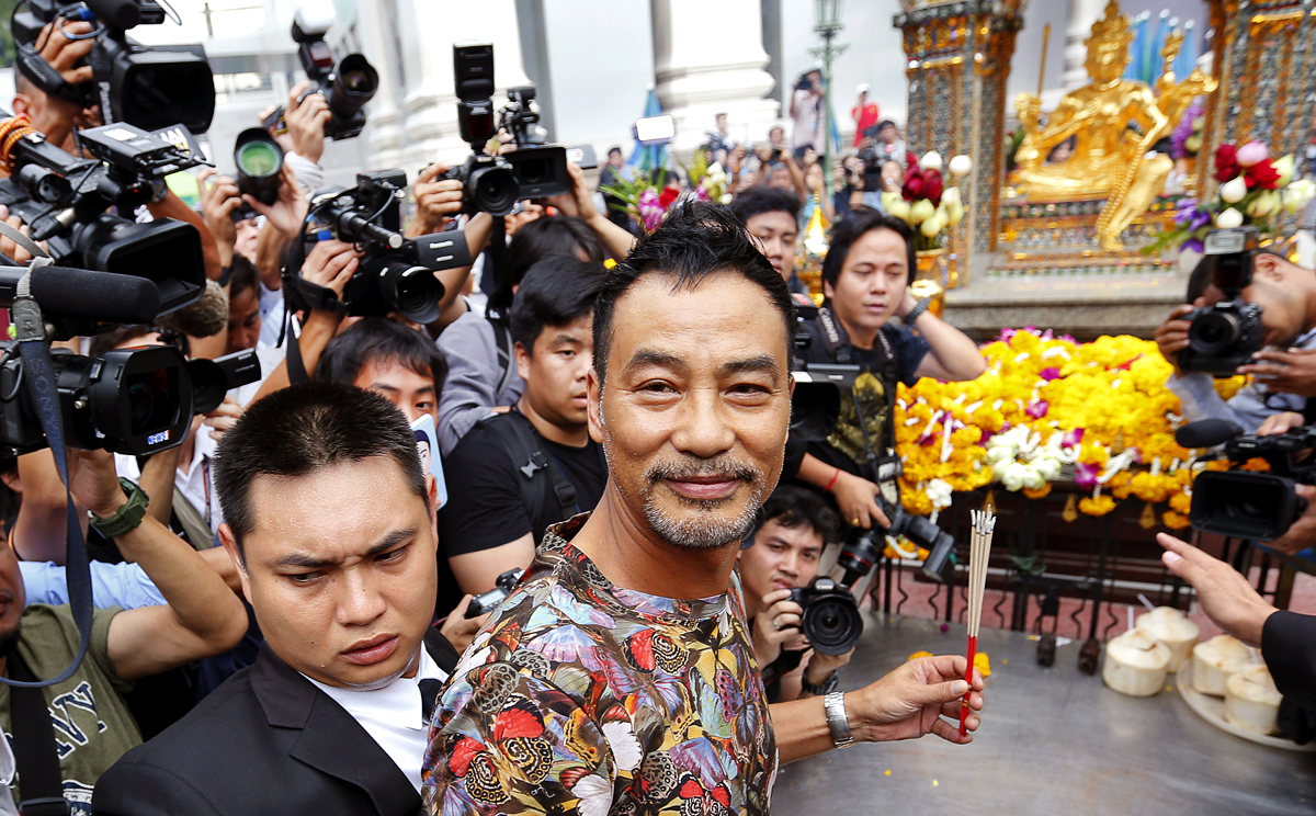 Hong Kong actor Simon Yam smiles during his visit to the Erawan shrine in central Bangkok, Thailand. Yam's visit is part of the Tourism Authority of Thailand's (TAT) campaign to restore tourist confidence. Photo: Reuters