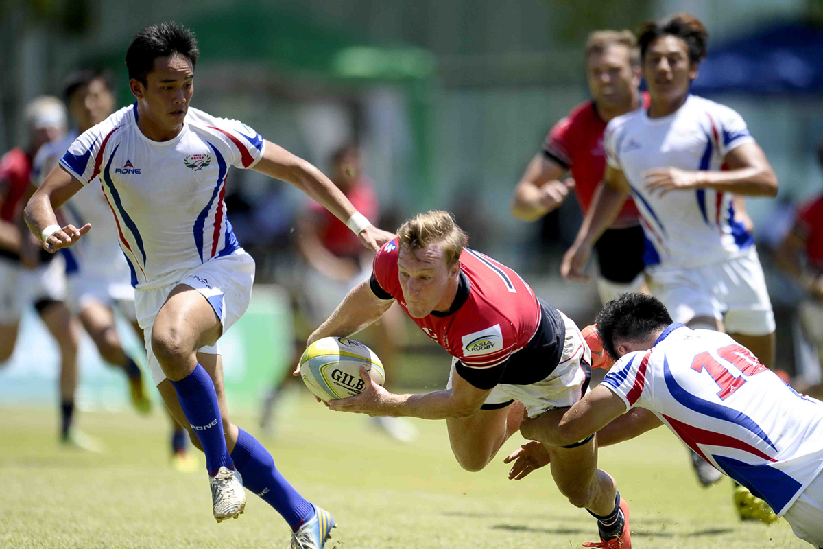 Tom McQueen dives in to score a try against Taiwan in the Sri Lanka Sevens Cup quarter-finals on Sunday. Photos: Thusith Wijedoru for Asia Rugby