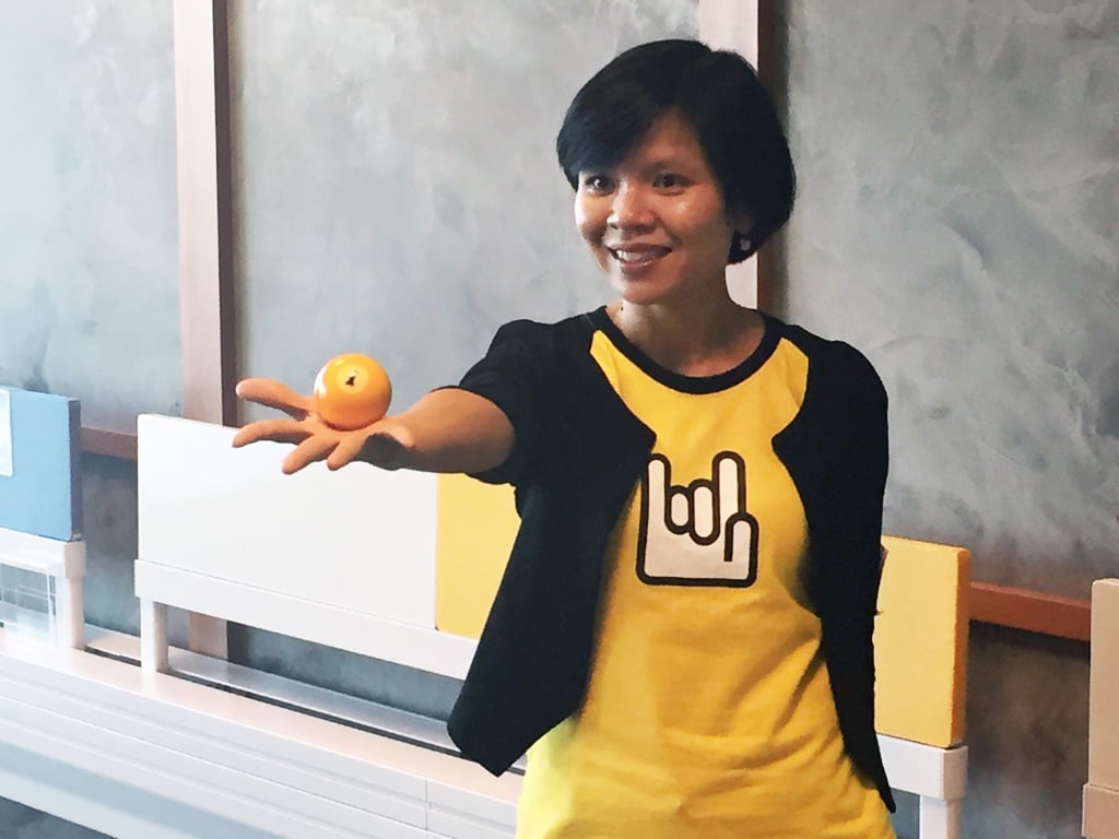 Anita Huang, head of the accelerator called Taiwan Startup Stadium (TSS), holds up a snooker ball with a No 1 on it to make clear her preferred investment destination. Photo: George Chen