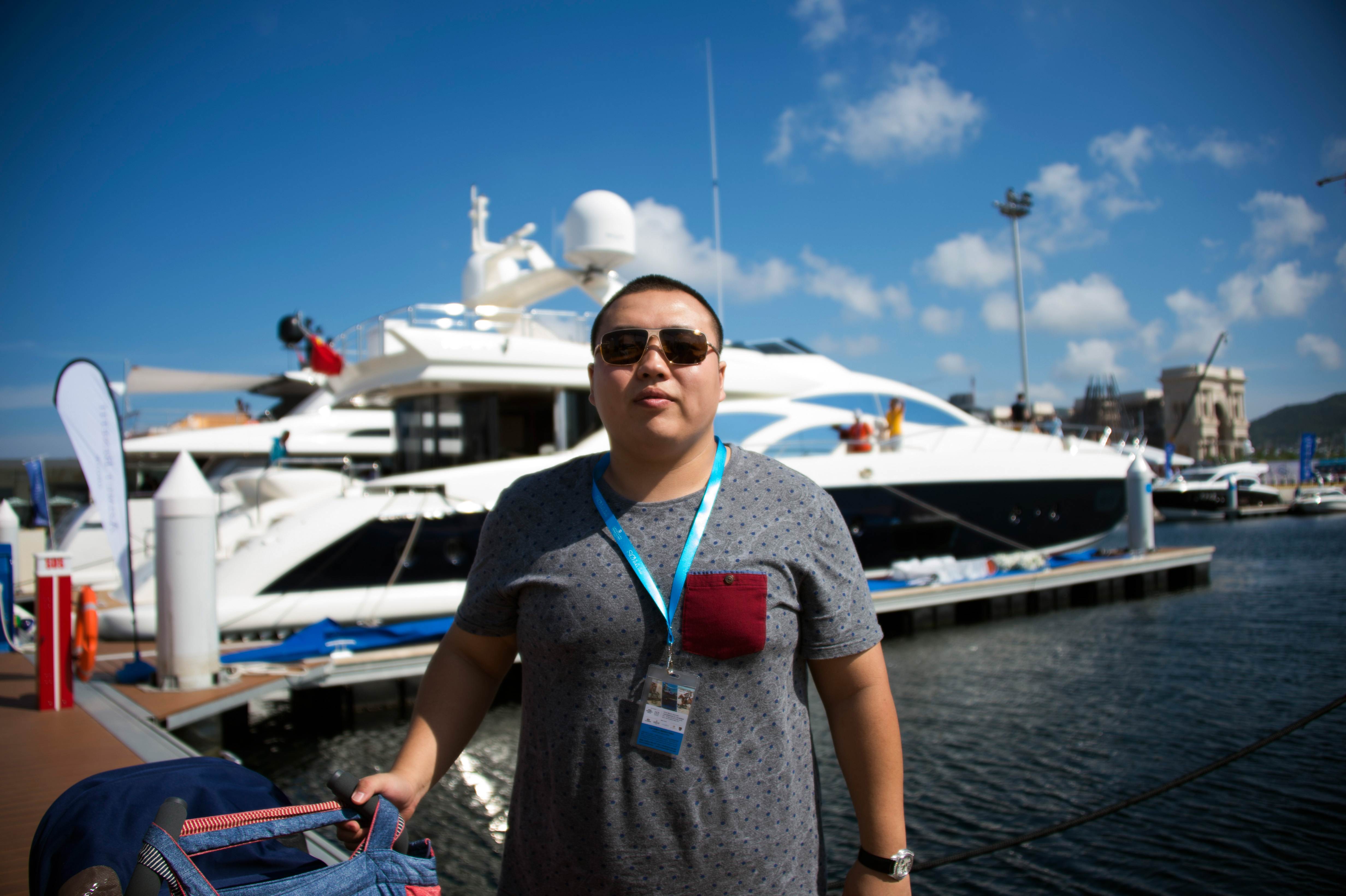 Chinese multimillionaire Li Wang, is known to have owned six luxury cars including a Bentley and a Porsche, and was in the market for a luxury yacht. Photo: AFP 