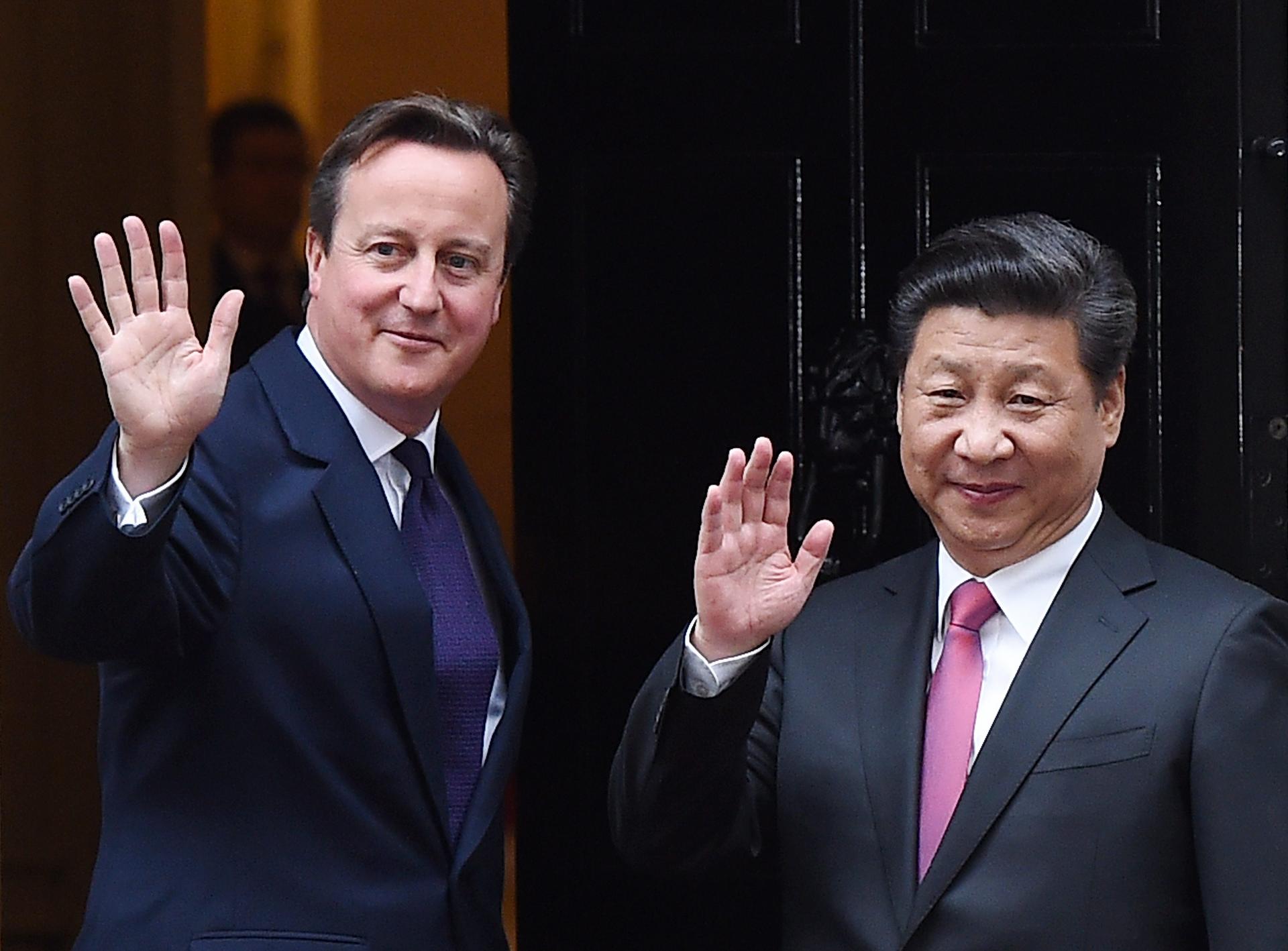 British Prime Minister David Cameron welcomes President Xi Jinping to 10 Downing Street yesterday.Photo: EPA