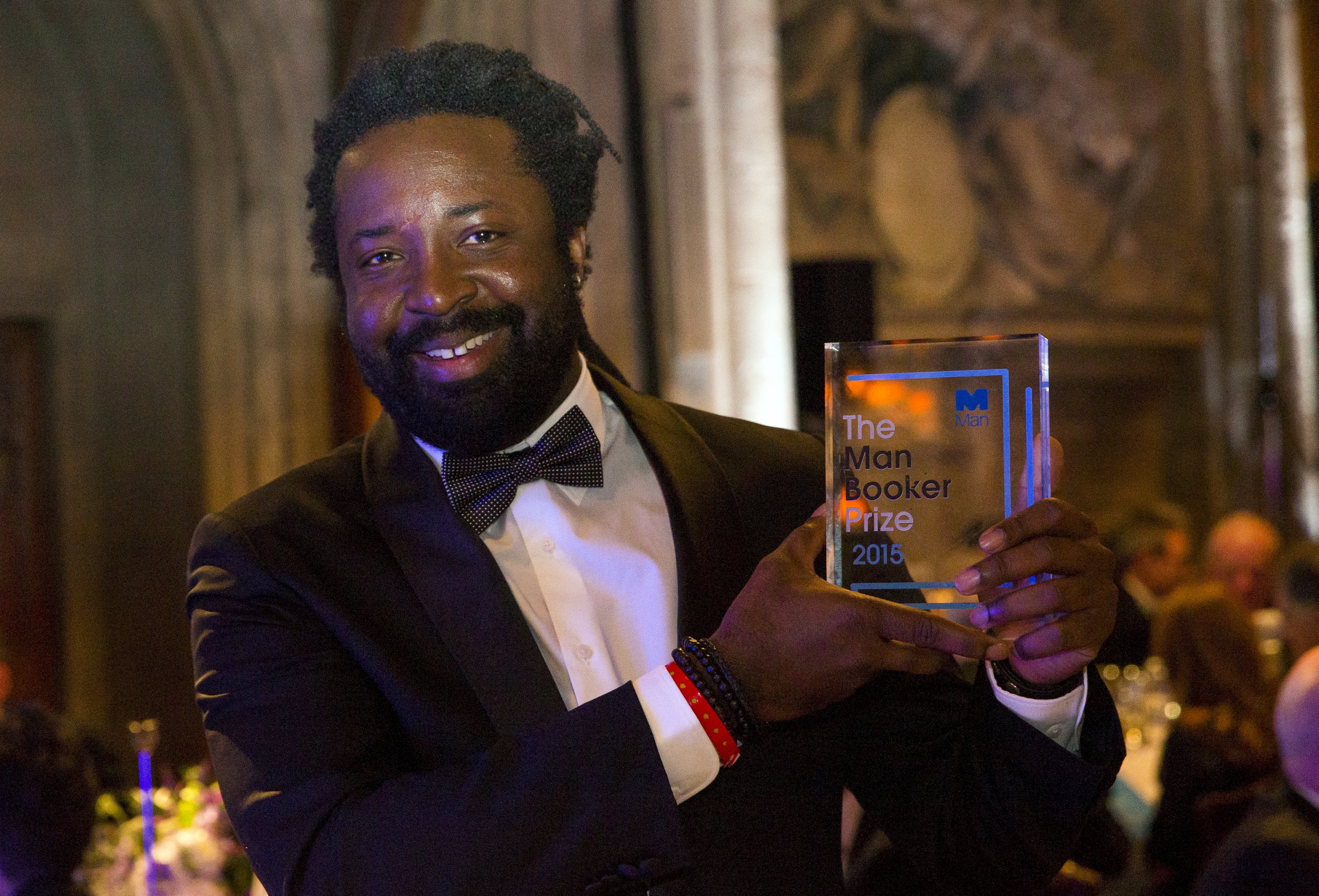 Marlon James poses with his prize at London's Guildhall. He destroyed the manuscript of his first novel and briefly stopped writing after scores of rejections from publishers. Photo: Reuters