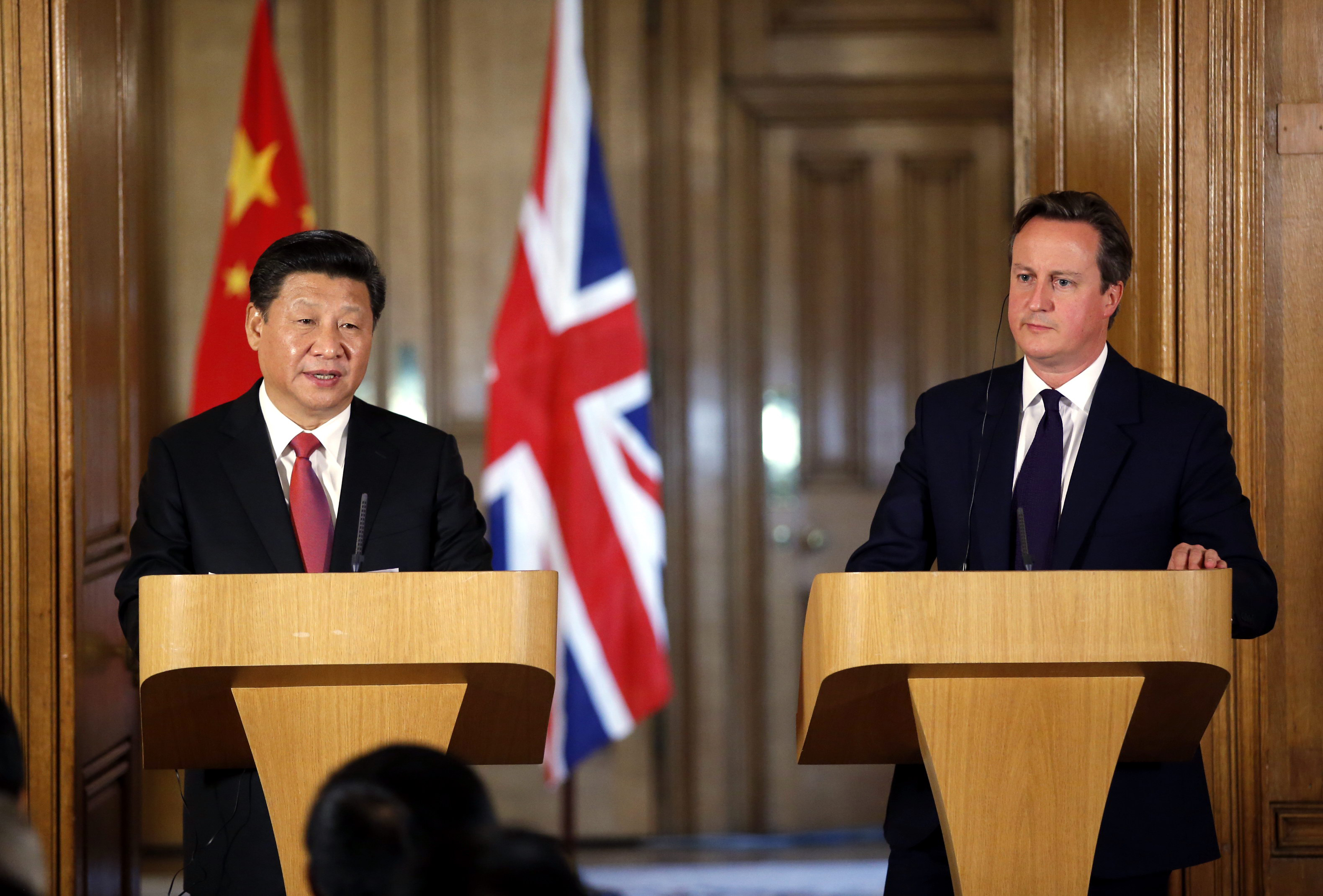 President Xi and British Prime Minister David Cameron speak to the press on Wednesday after they met during the Chinese head of state's visit to the UK. Photo: Xinhua