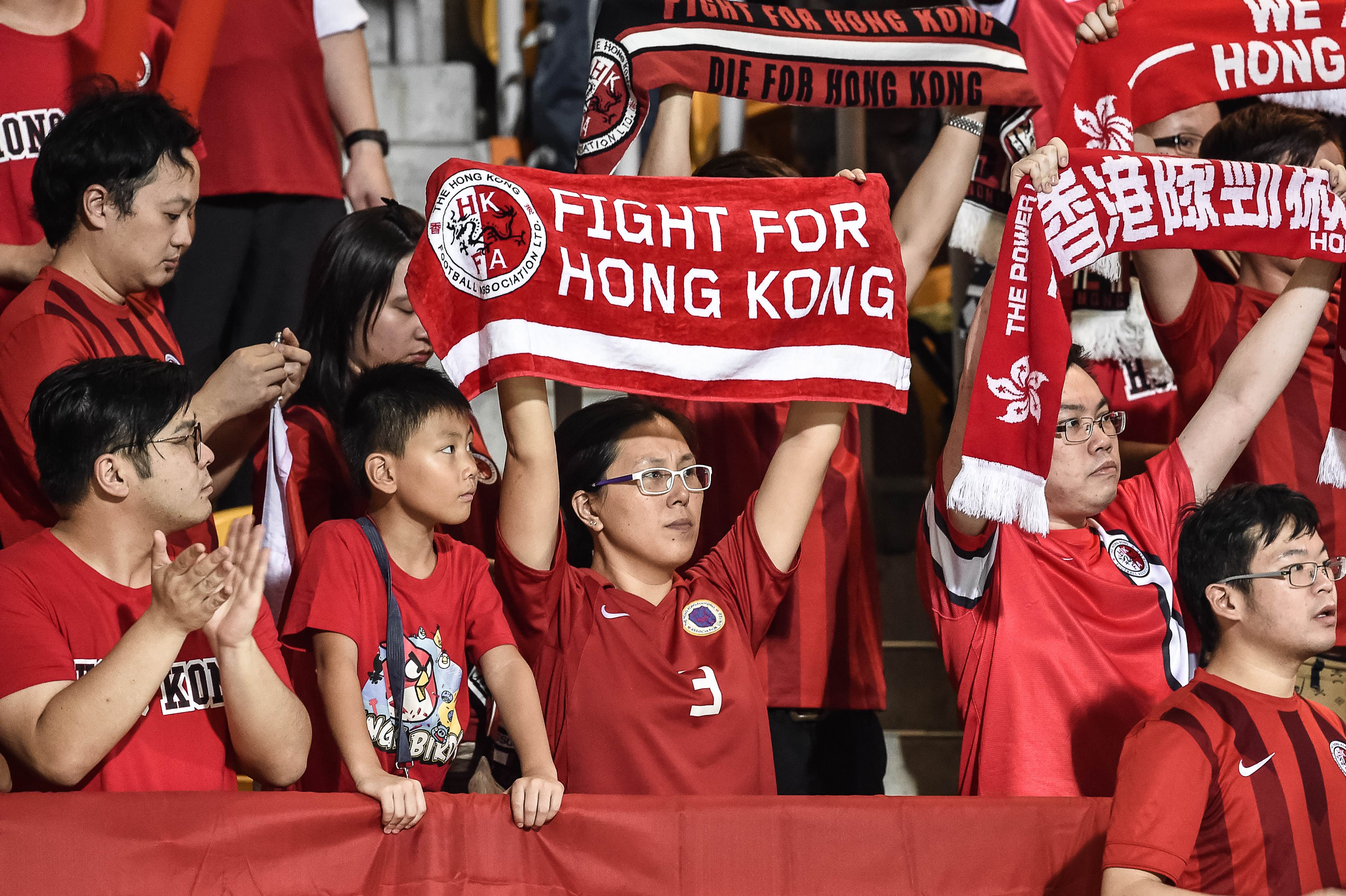 Fans watch Hong Kong v Qatar. Photo: AFP