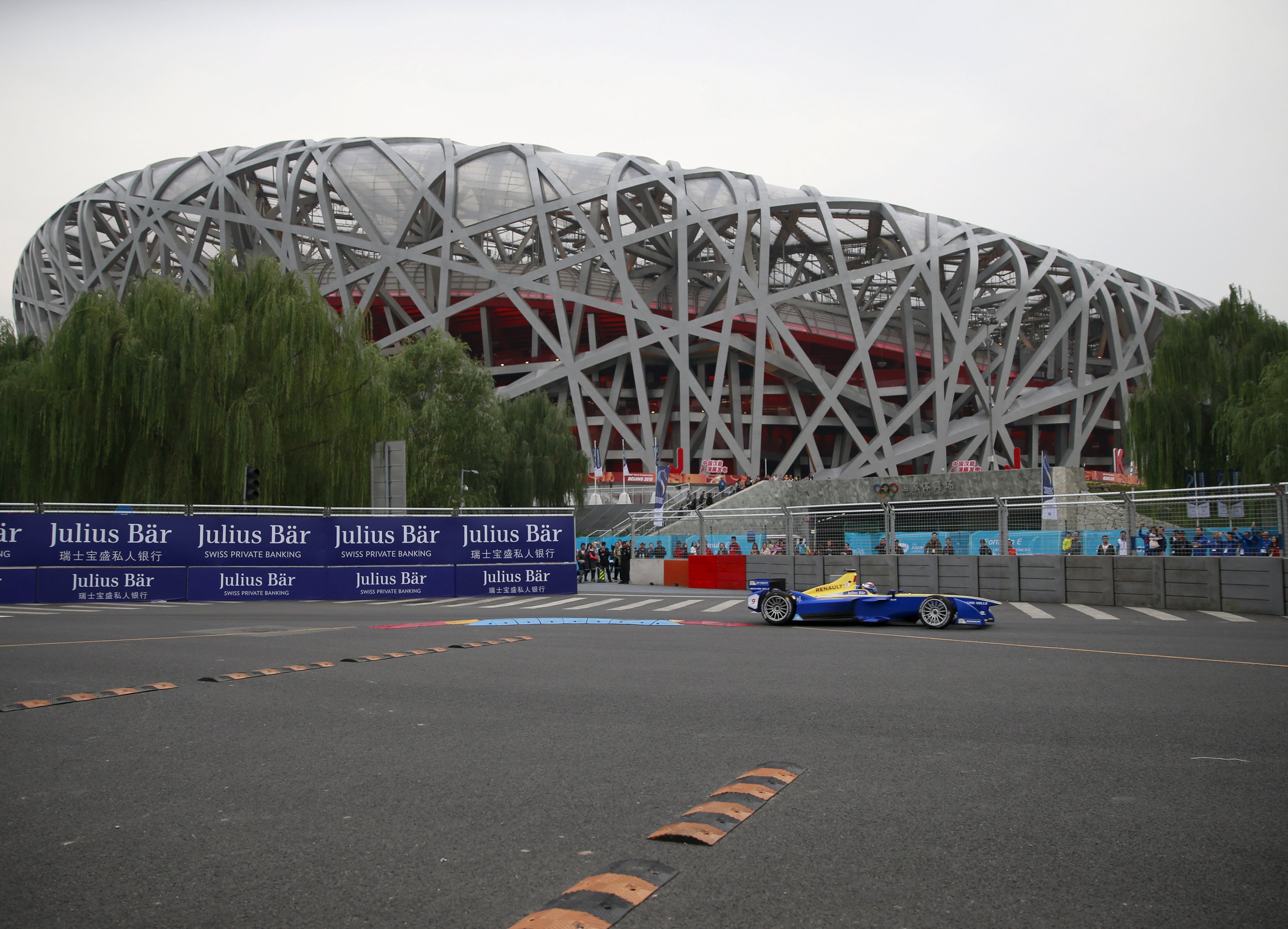 Sebastien Buemi races past the Bird's Nest Stadium in Beijing. Photo: Reuters