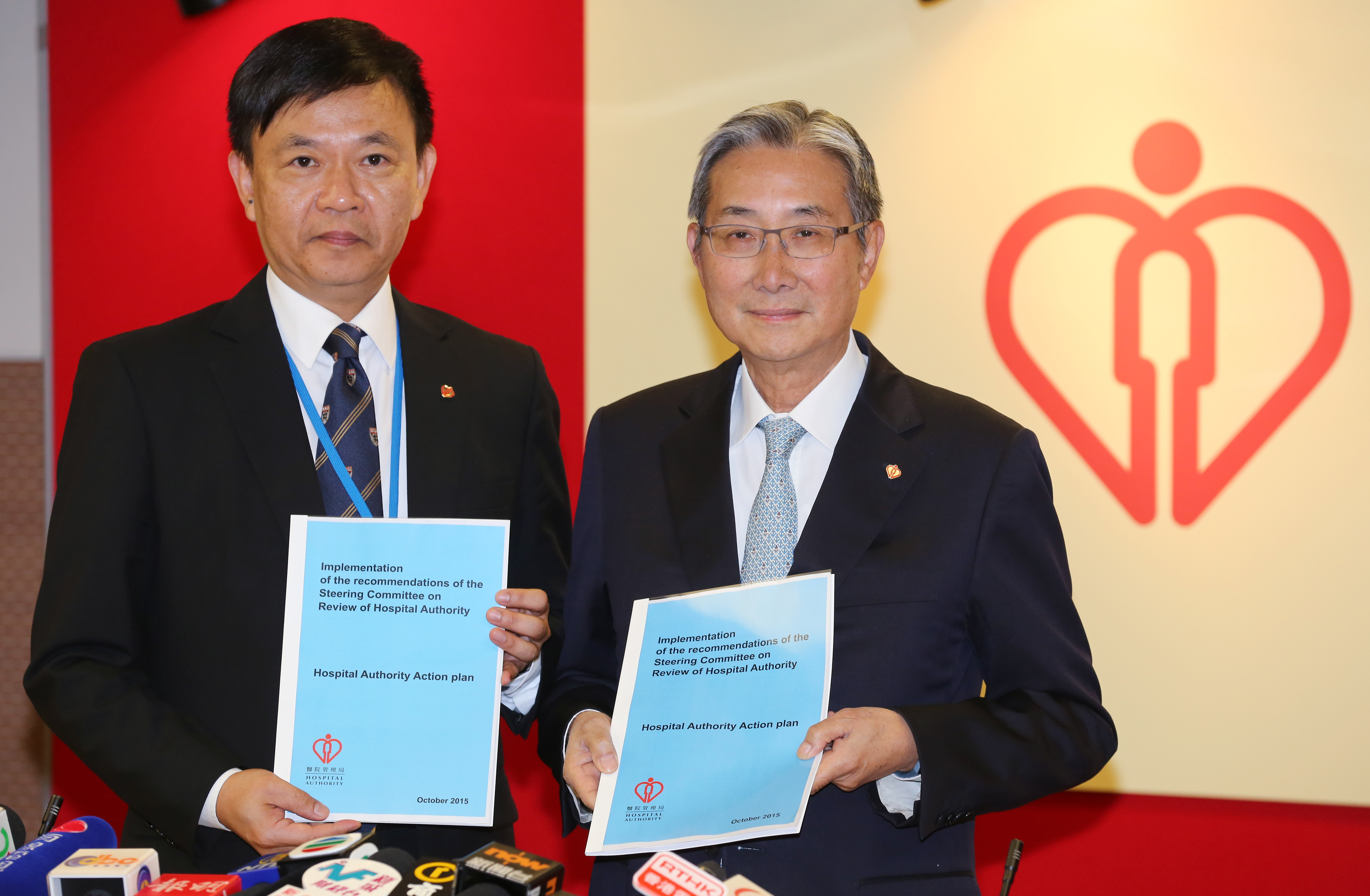 The Hospital Authority's chief executive Leung Pak-yin (left) and chairman John Leong speak up on the pay rise. Photo: Edward Wong 