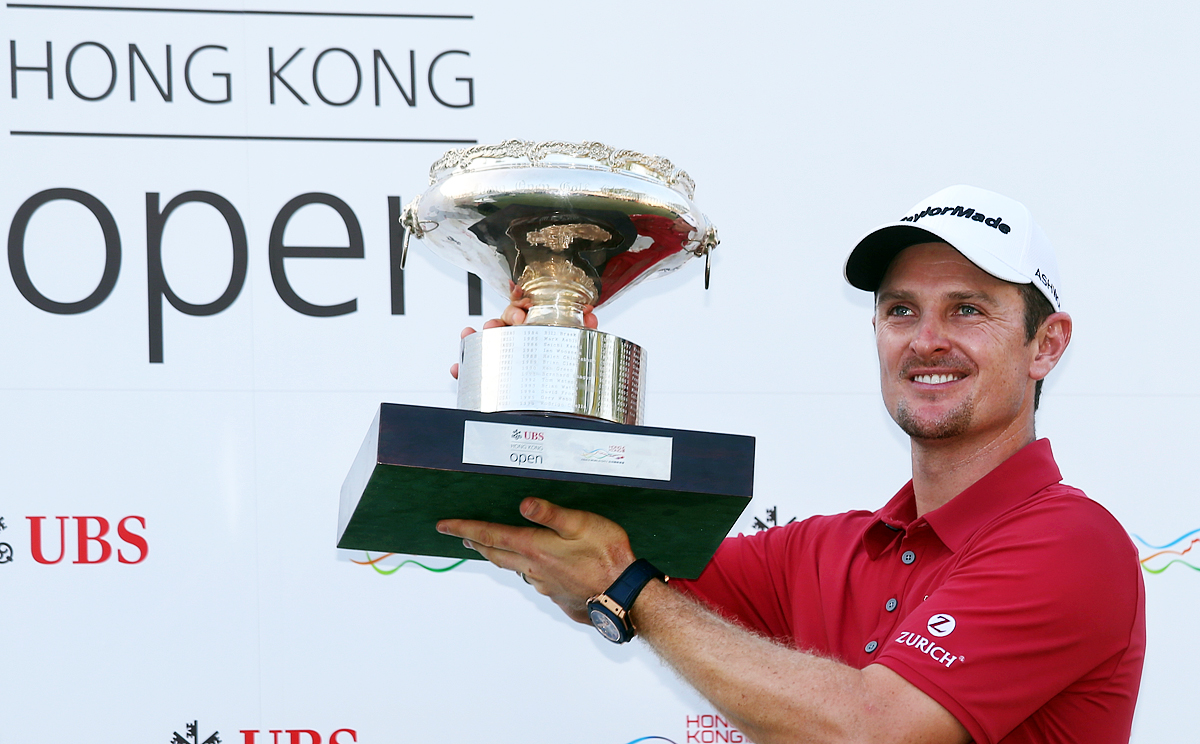 Justin Rose of England celebrates with the championship trophy after the final round of the Hong Kong Open at the Hong Kong Golf Club. Photos: K.Y. Cheng