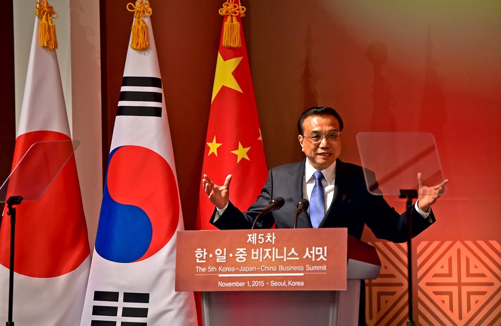 Chinese Premier Li Keqiang speaks during a business summit attended by South Korean President Park Geun-hye and Japanese Prime Minister Shinzo Abe in Seoul. Photo: Reuters