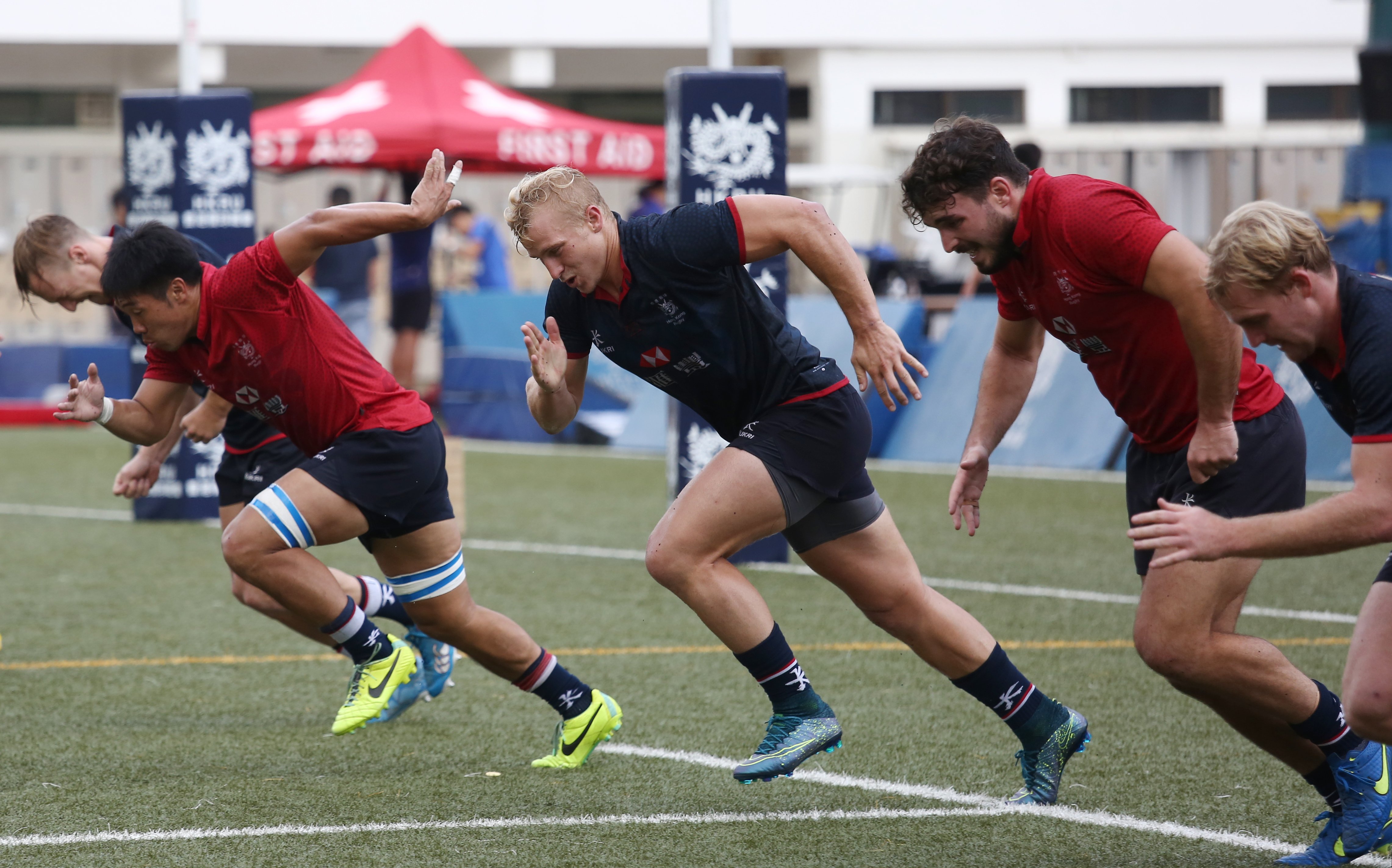 Hong Kong men's sevens squad captain Max Woodward (centre) trains with team-mates at King's Park in Ho Man Tin ahead of next weekend's Asia Rugby Sevens Qualifier for the Rio 2016 Olympics. Photos: Jonathan Wong/SCMP
