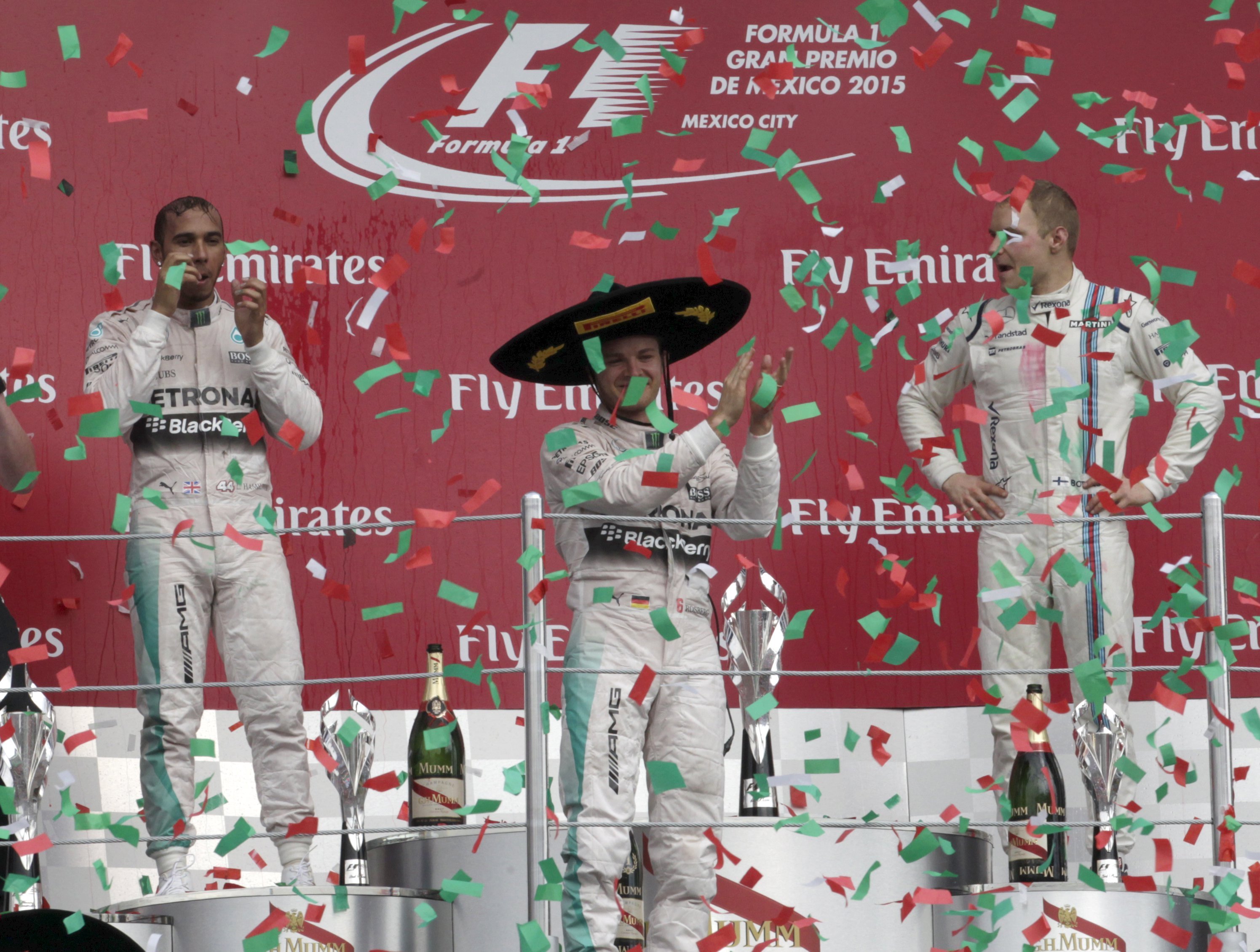 Nico Rosberg (centre) celebrates winning a colourful Mexican GP. Photo: Reuters