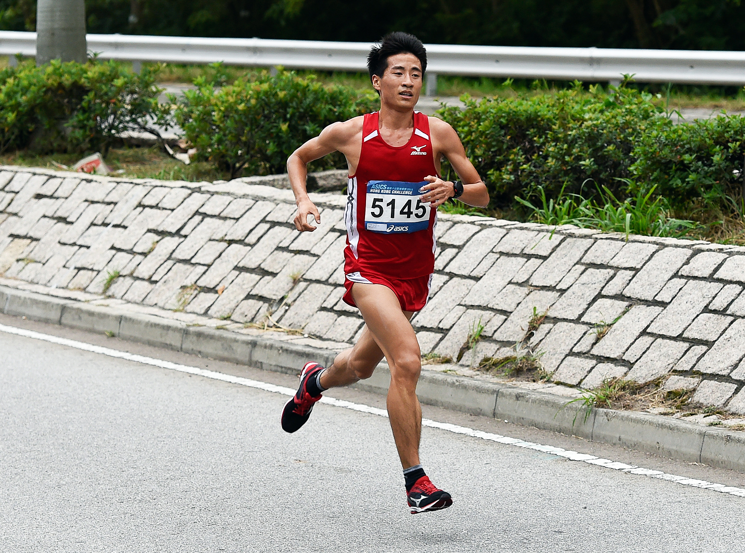 Wang Kun strides out on his way to winning the Asics Hong Kong 10k Challenge. Photos: Richard Castka