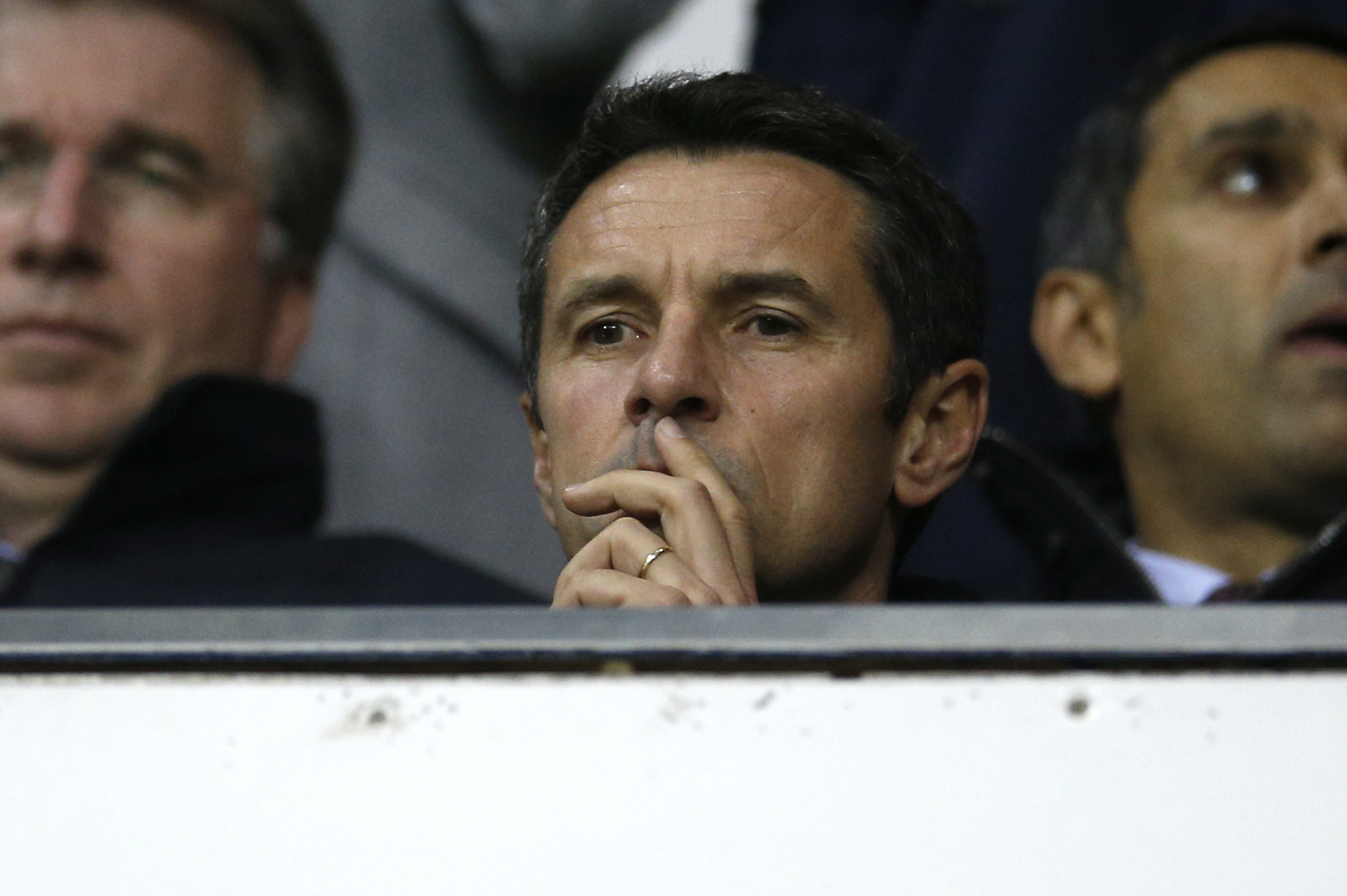 Remi Garde watches from the stands. Photo: Reuters