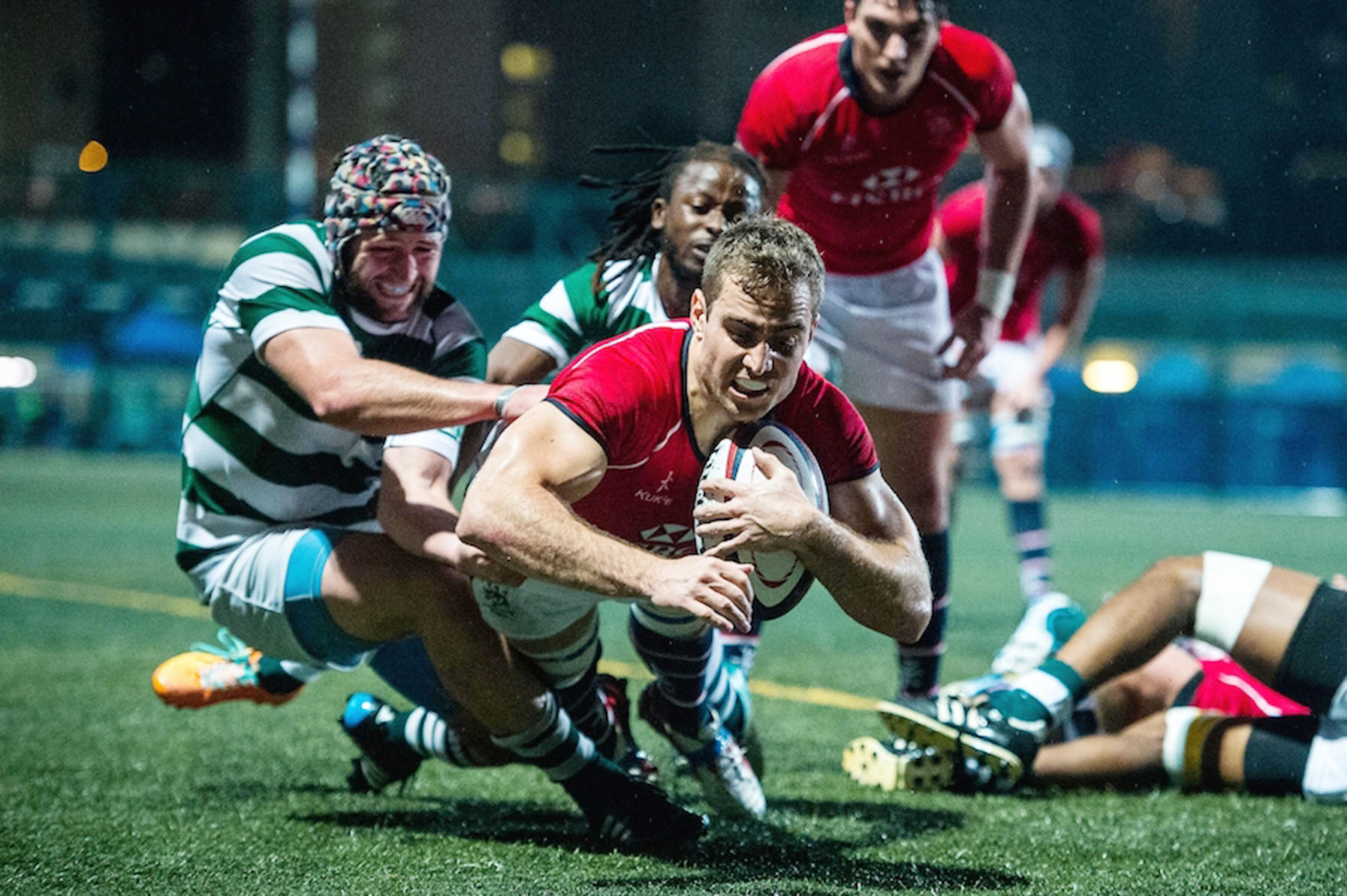 Hong Kong scrum-half Tom Marshall dives over to score against Zimbabwe in their Cup of Nations match on Friday. Photos: HKRU