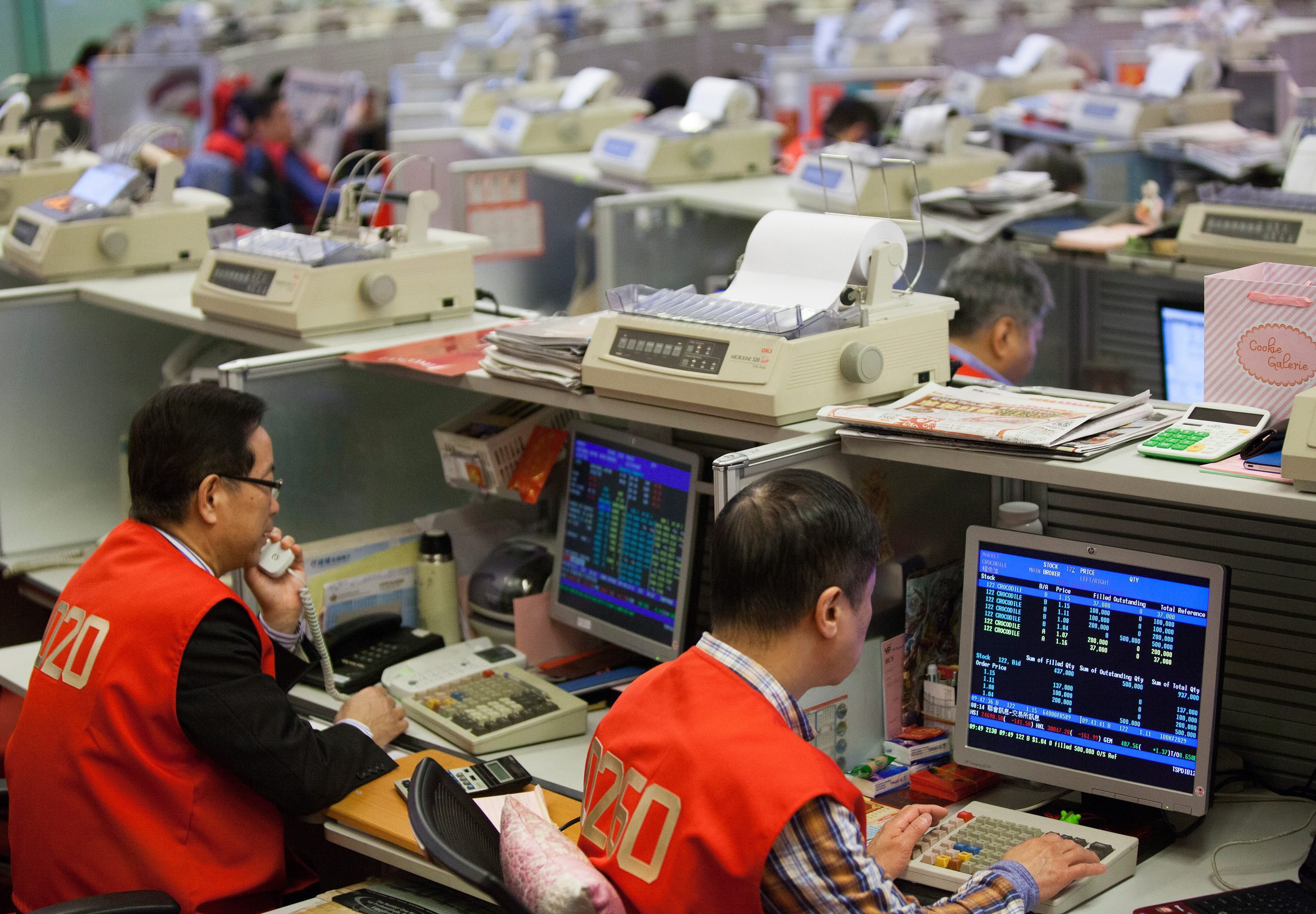 Stock traders are seen on the floor of the Hong Kong stock exchange in Hong Kong. Photo: EPA