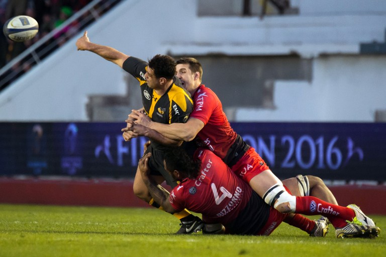 Wasps flanker George Smith gets a pass away despite pressure from Toulon’s Jocelino Suta (bottom) and Thibault Lassalle during their European Rugby Champions Cup clash at the Stade Mayol last Sunday. Toulon won 15-11. Photos: AFP