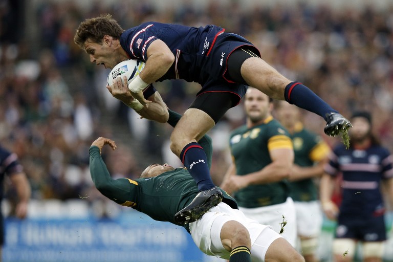Blaine Scully, starting fullback for the US Eagles’ Americas Rugby Championship opener against Argentina on Saturday, gets up and over Bryan Habana of the Springboks at the 2015 Rugby World Cup. Photo: AFP