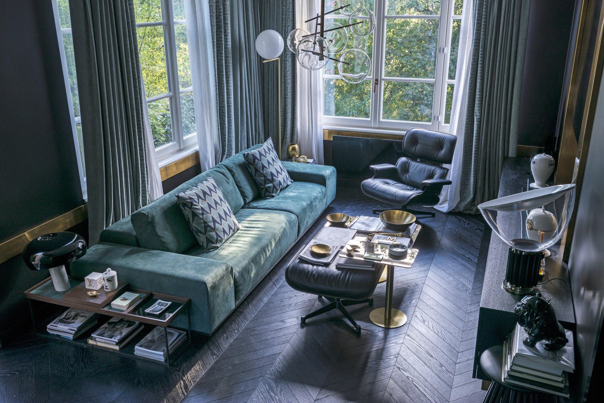 Smoky walls and dark wooden floors are paired with soft fabrics in jewel tones. Photography:  Valentina Sommariva / Living Inside