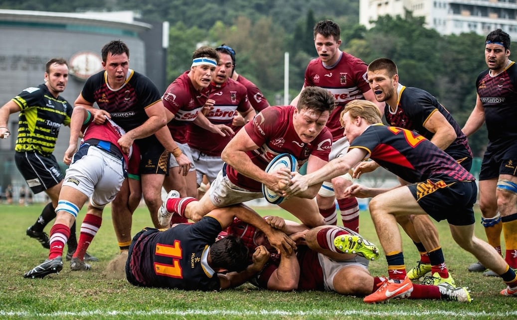 Kowloon fly-half Jack Neville dives over to score a try and hand his side a late lead in their losing semi-final clash with HKCC in the Grand Championship play-offs on Saturday. Photos: HKRU