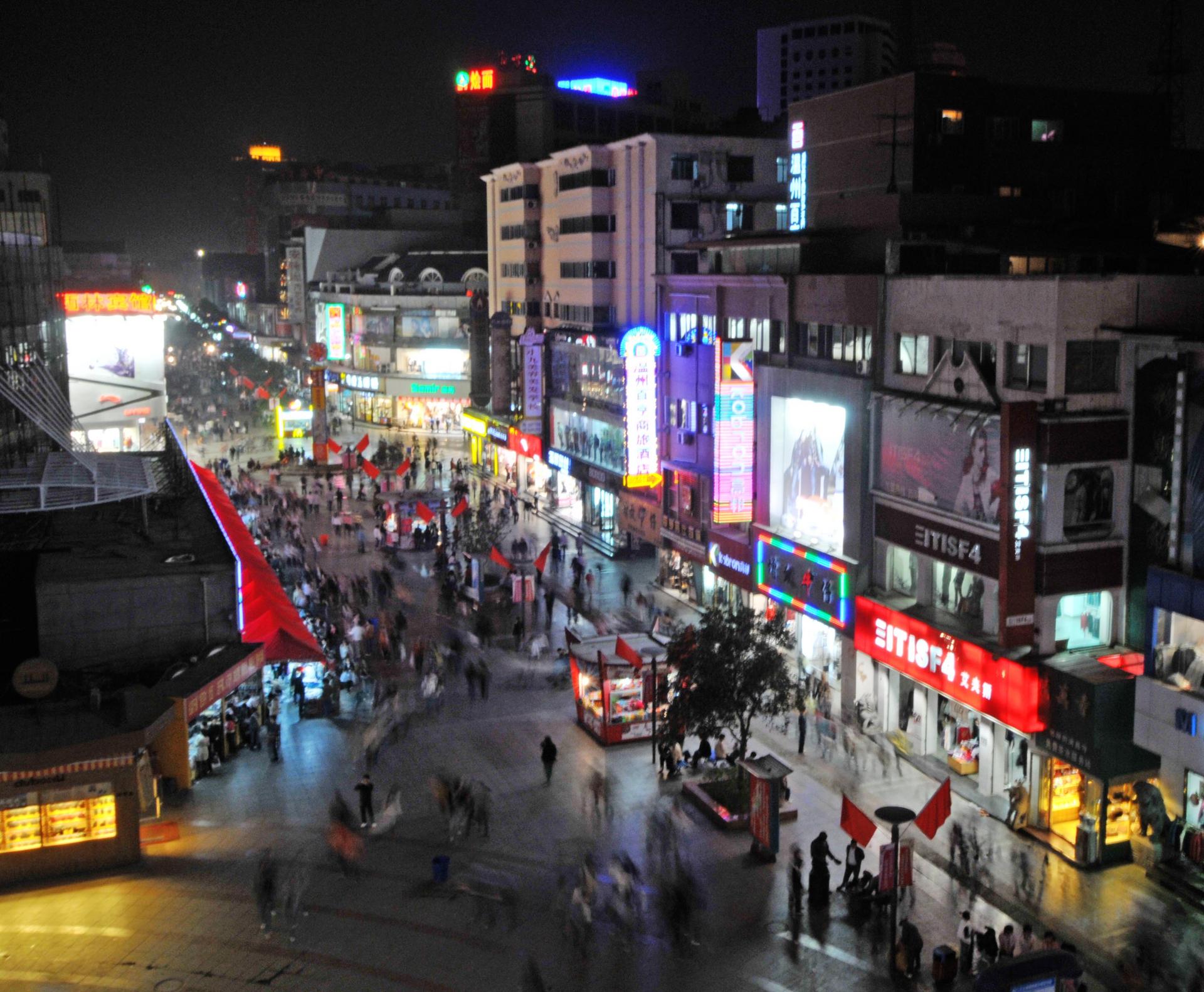 Night view of a shopping street in Zhengzhou.Photo: ImagineChina