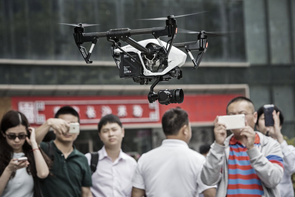 The world's largest drone maker, DJI, demonstrates its DJI Inspire 1 Pro model in its home city, Shenzhen, as the company innovates new technology and broadens export markets for commercial unmanned aerial vehicles. Photo: Bloomberg