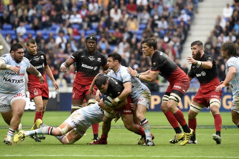 Racing 92 fly-half Dan Carter (centre-right) battles for the ball during his team’s 21-9 defeat by Saracens in the final of the European Rugby Champions Cup last weekend. Carter was carrying an injury ahead of the match and played just 43 minutes. Photos: AFP
