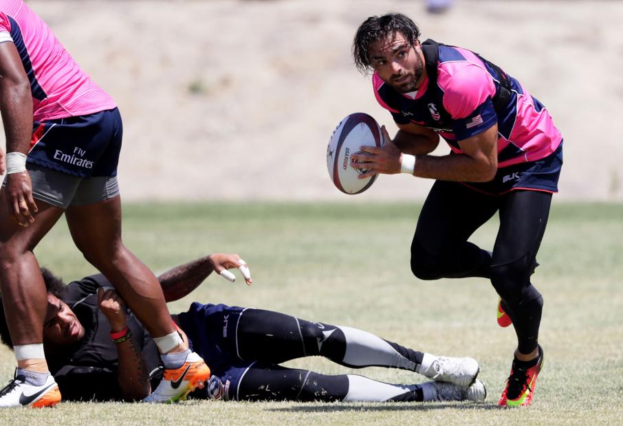New England patriots defensive back Nate Ebner runs with the ball during a Team USA rugy sevens training session at the Olympic Center in Chula Vista, California on Friday. Photos: AFP
