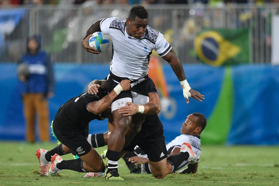Josua Tuisova carries the ball into battle for Fiji in their 12-7 quarter-final victory over New Zealand on Wednesday. Photo: AFP