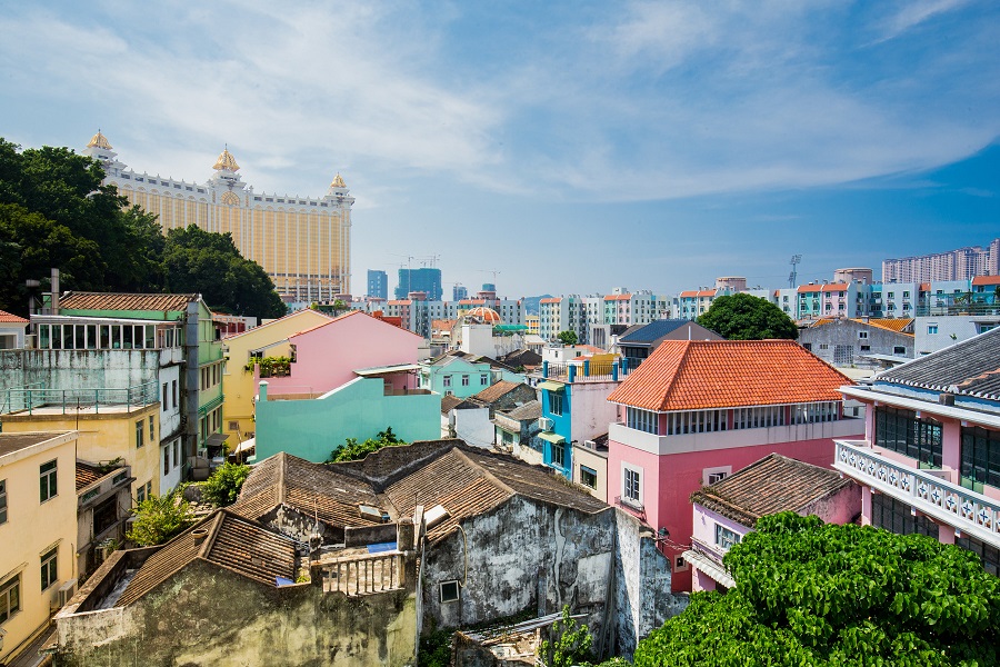 Galaxy Macau resort towers over Taipa Village in a juxtaposition of modernity and tradition.