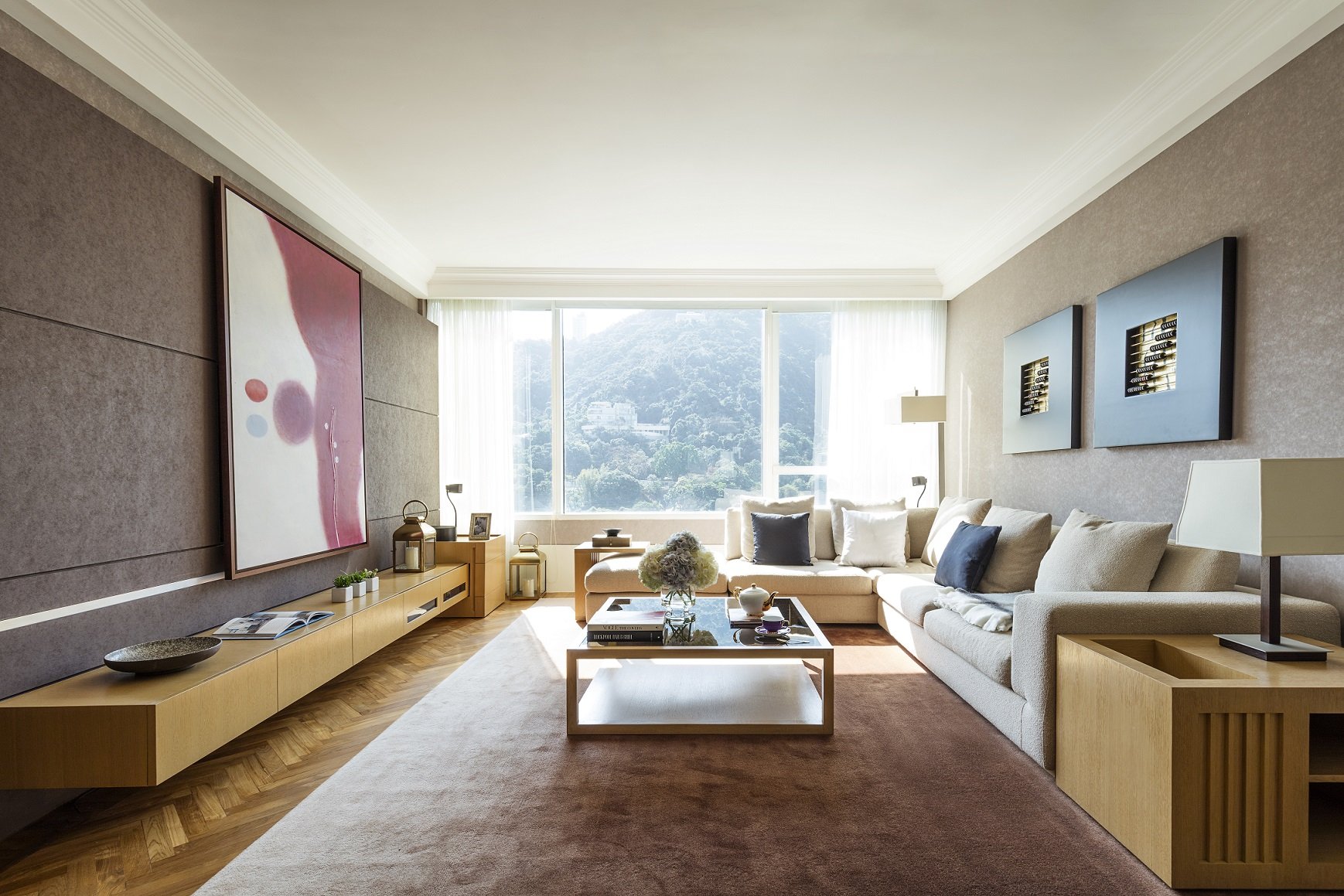 The floor-to-ceiling windows in Pacific Place Apartments increase the depth of field of the already spacious suite.