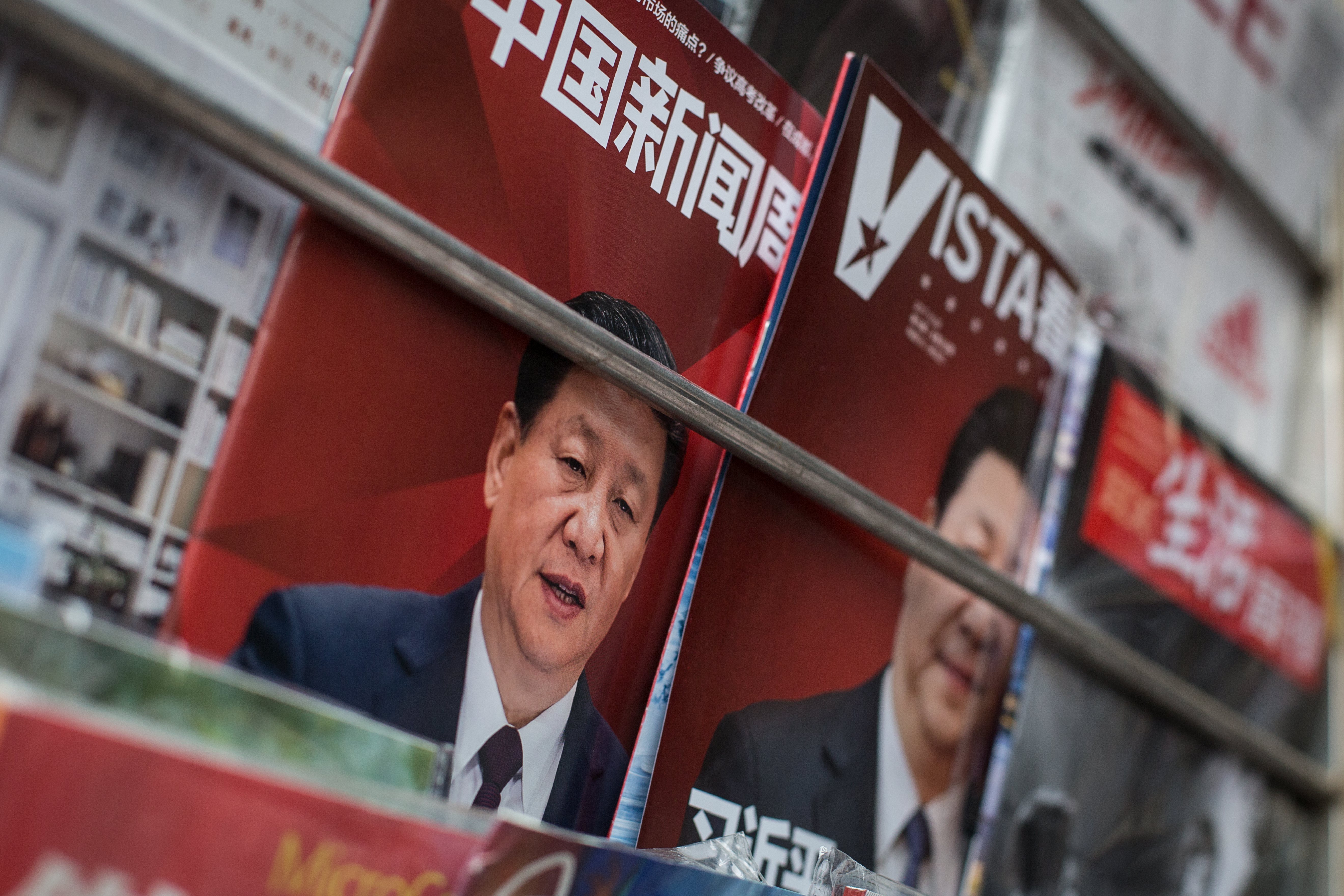 The front cover of magazines showing Chinese President Xi Jinping are placed for sale at a newspaper stall in Beijing. Photo: EPA
