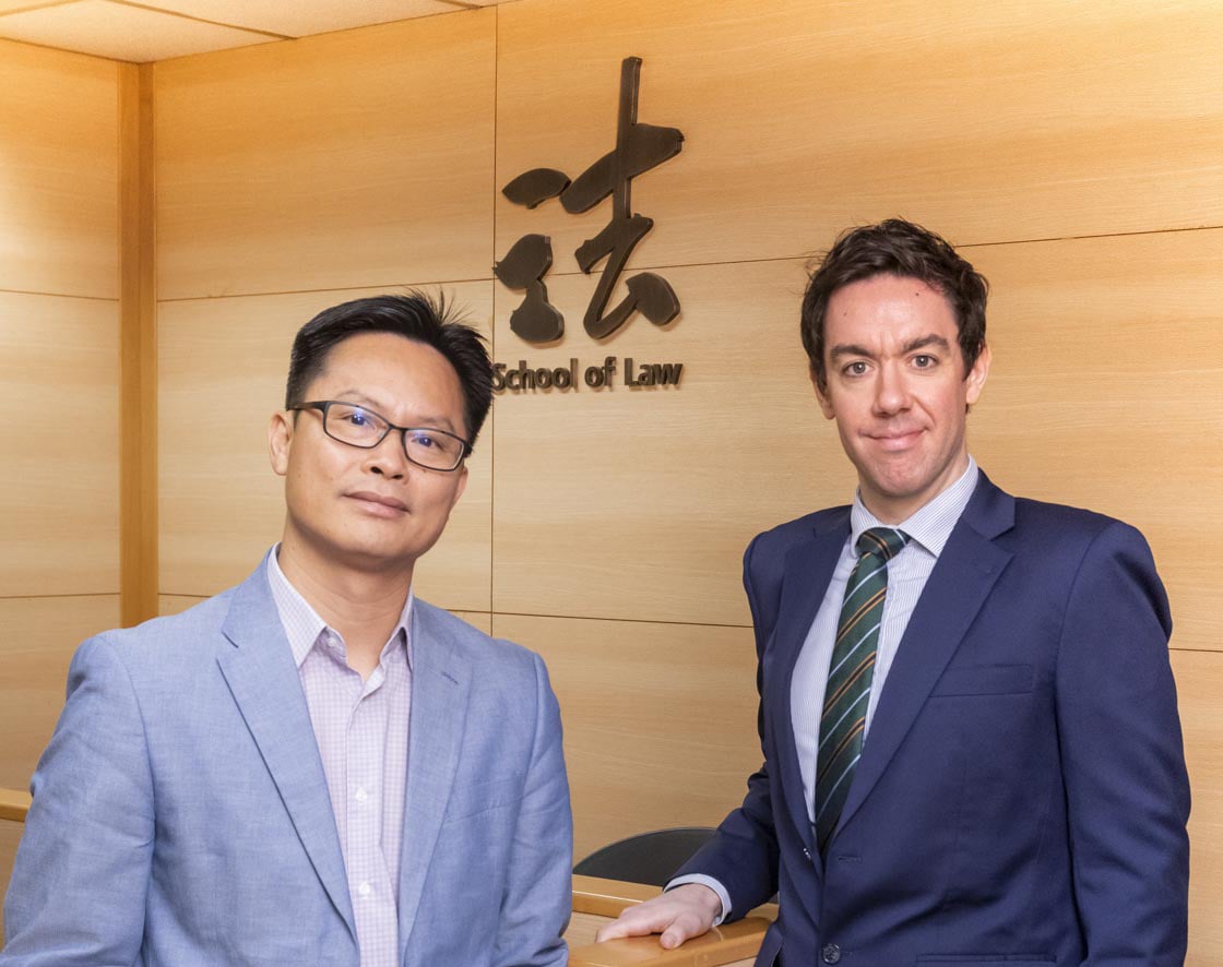 Dr Guan Wenwei (left) and  Dr Stephen Thomson (right),  CityU school of Law.