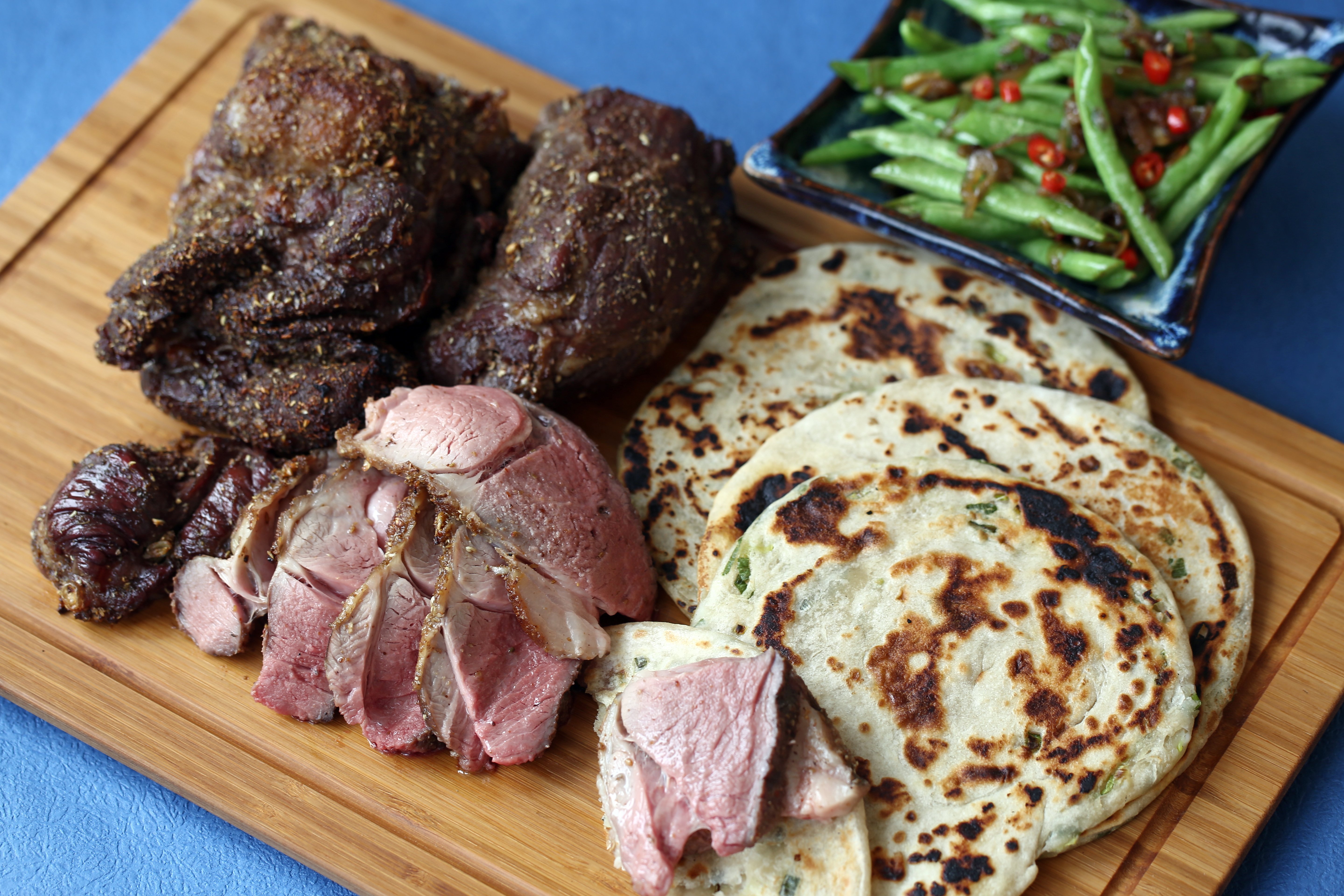 Slow-cooked butterflied leg of lamb with Sichuan peppercorn spice rub