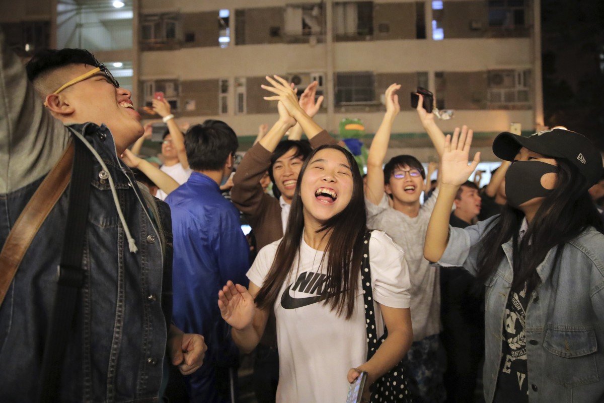 Pro-democracy supporters celebrate huge gains in the district council elections. Protests have weighed on trading sentiment in Hong Kong. Photo: AP