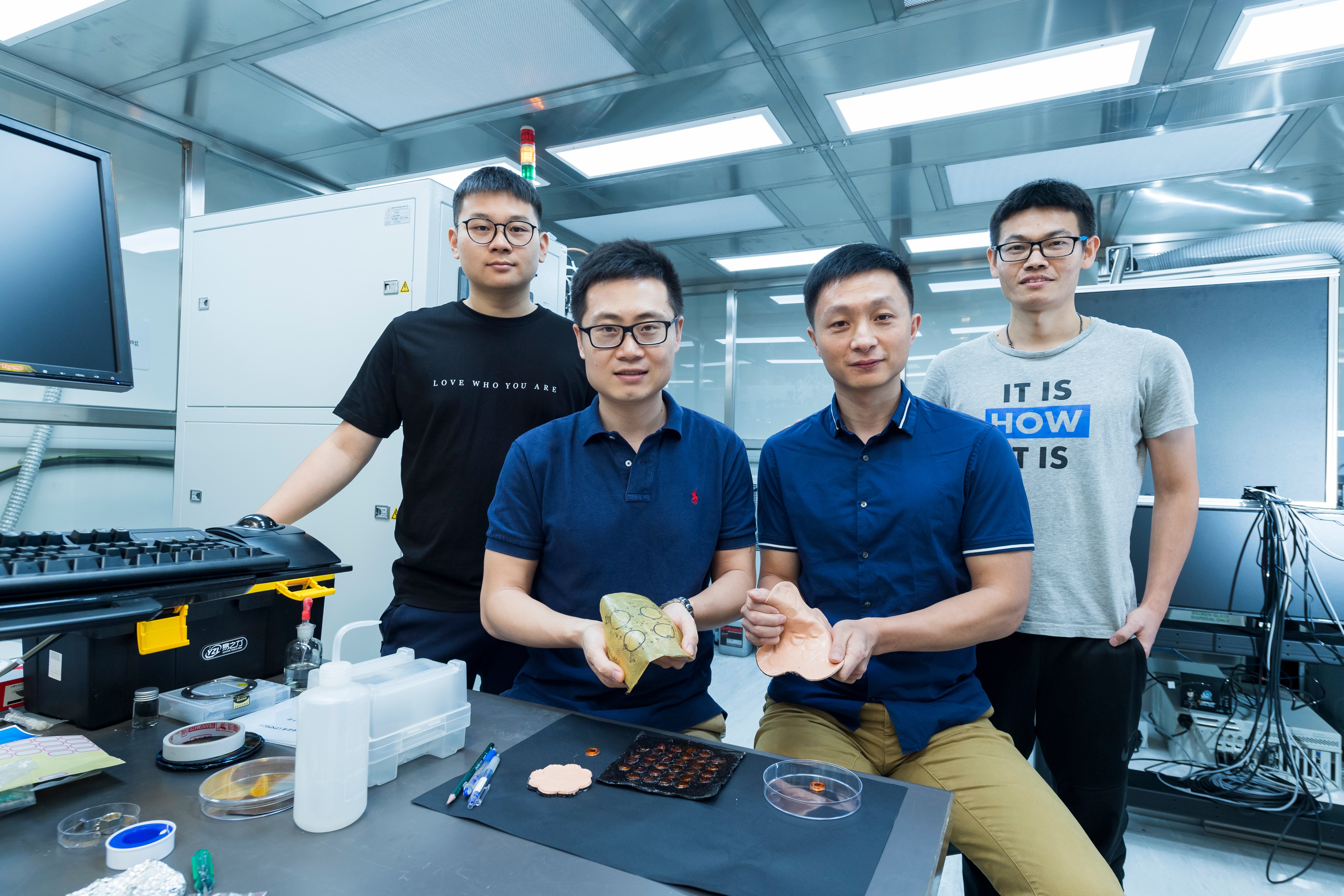 Dr Yu Xinge (front row, left) and his research team at CityU.