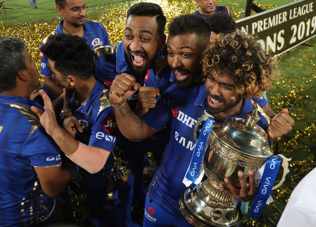 Mumbai Indians celebrate their win in the final cricket match of the Indian Premier League in 2019 with a trophy decorated with Vivo-branded ribbons. (Picture: Mahesh Kumar A./AP Photo)