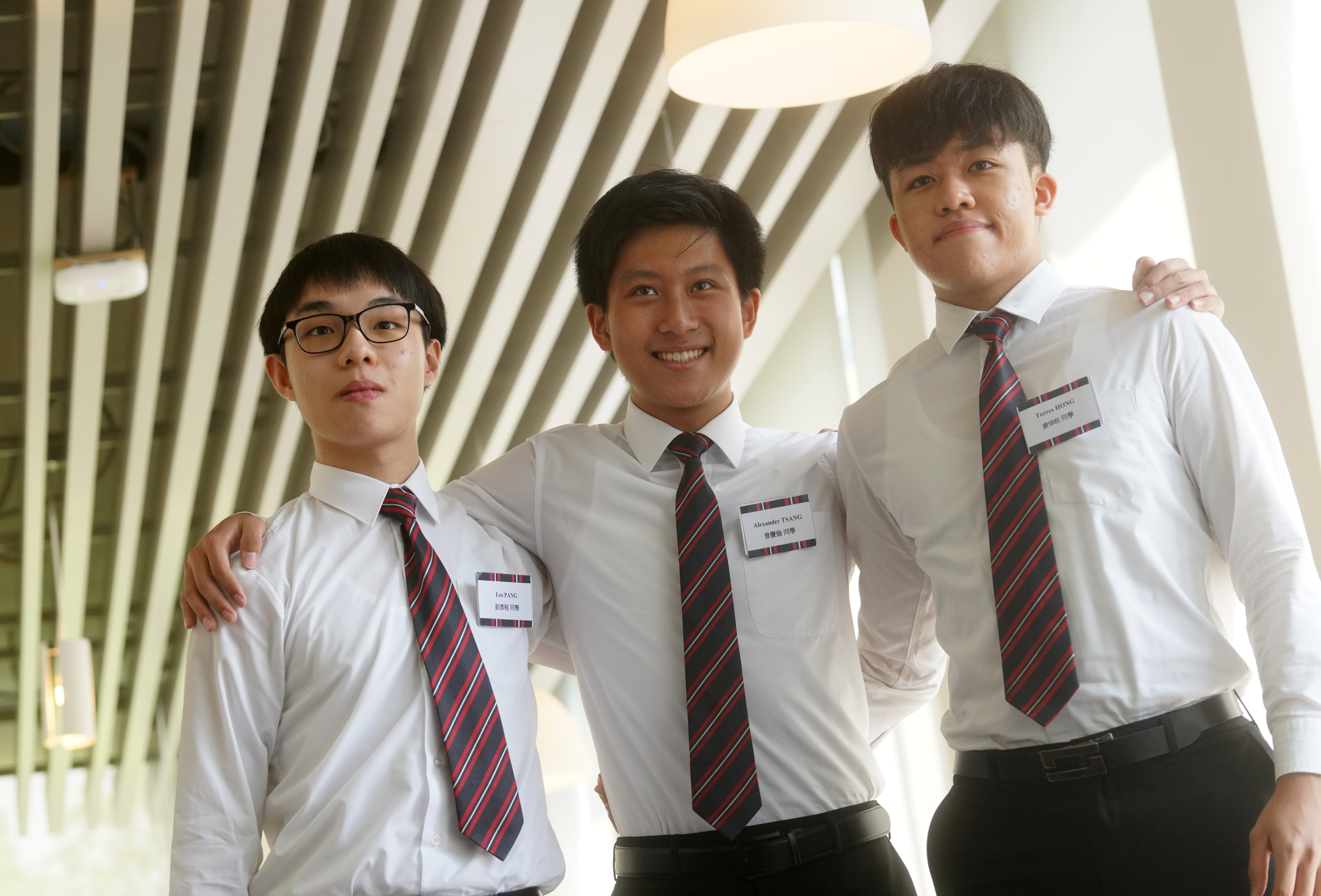 Leo Pang Yin-ching, Alexander Tsang Hing-lun and Torres Hong Cheuk-wun of Diocesan Boys’ School all achieved the maximum score of 45 points on the IB exam. Photo: SCMP /  Winson Wong